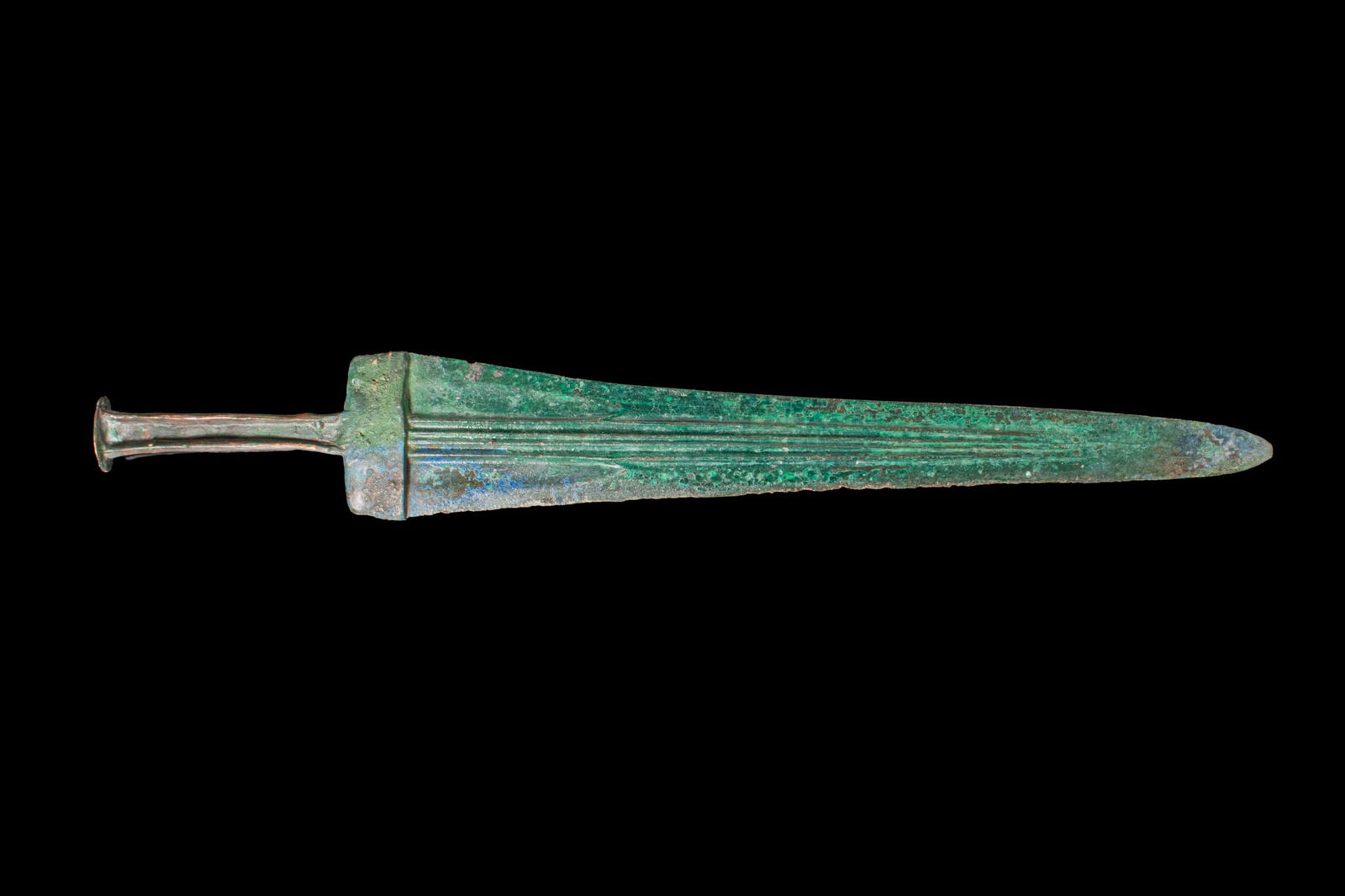 BRONZE AGE / EARLY GREEK PERIOD BRONZE DAGGER: Ca. 1100 - 800 BCA bronze dagger with a double-edged blade of elongated triangular form, both faces with a series of parallel fullers running from the base almost to the point, a flat guard, and a