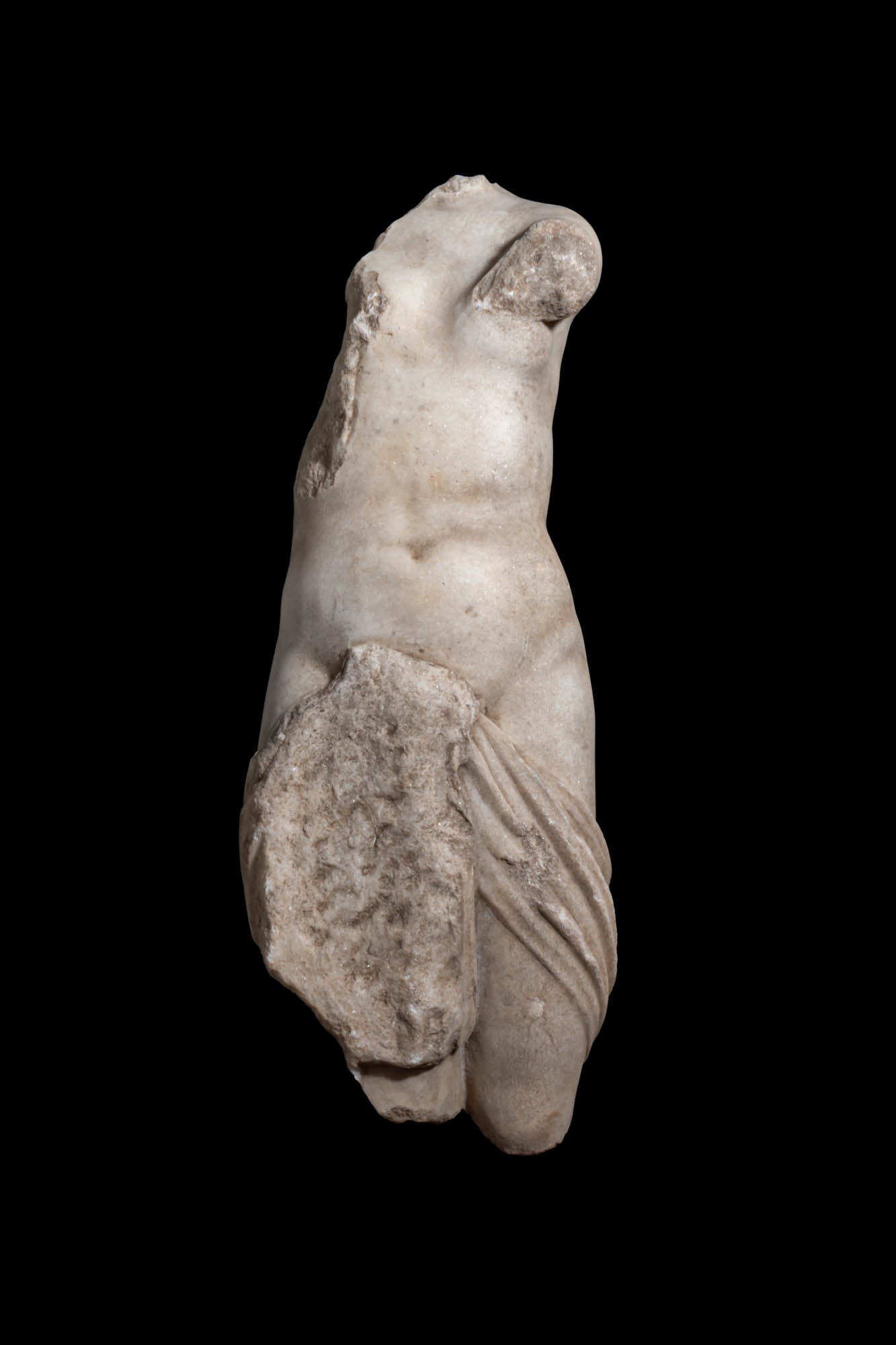 LIFE SIZE ROMAN MARBLE STATUE OF APHRODITE: Ca. AD 100 - 200 A marble statue fragment of Aphrodite, with the nude torso and upper legs to above the knees. The abdomen is modelled with a gently recessed navel and soft transitions across the wais