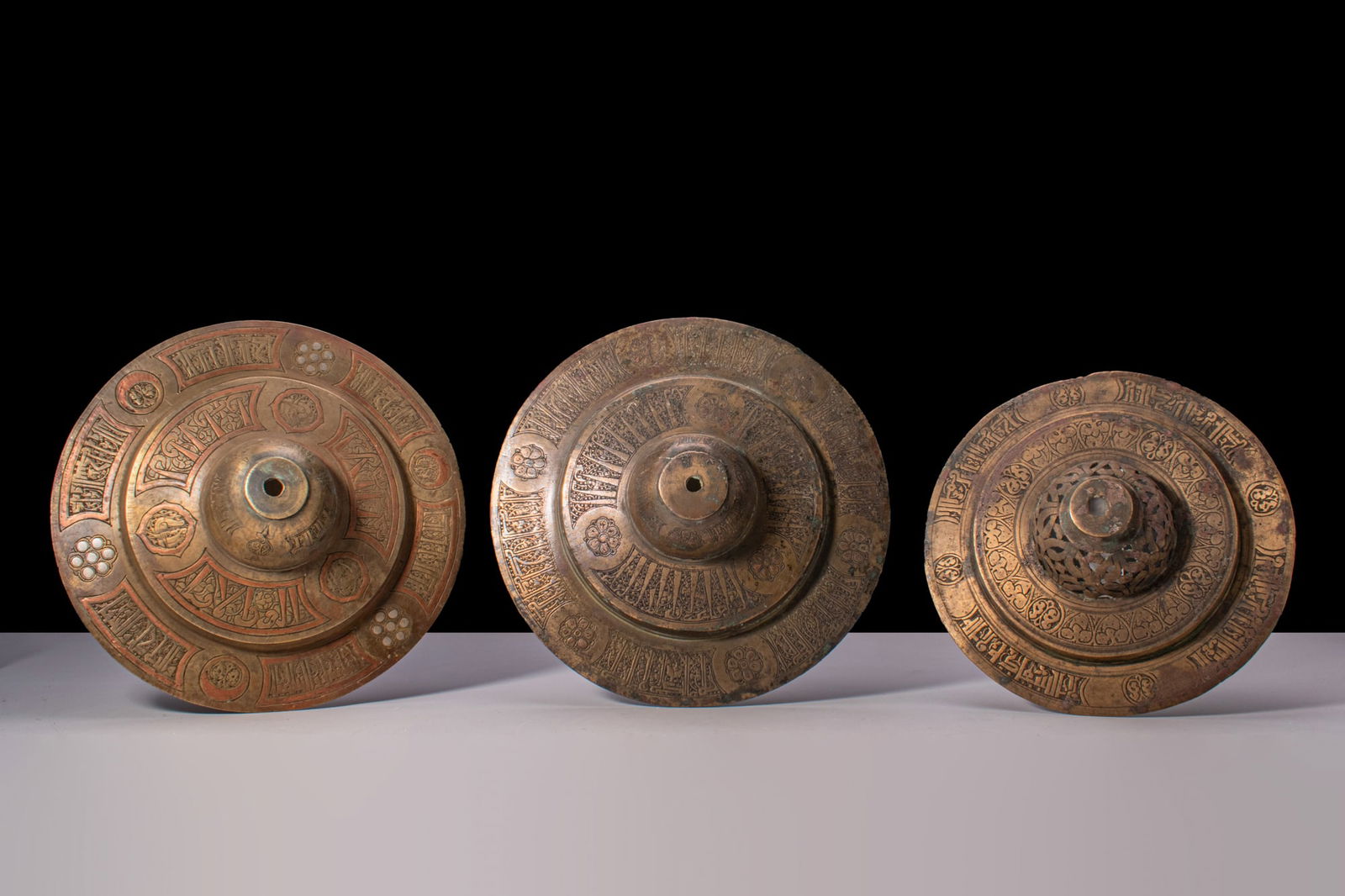 COLLECTION OF SELJUK INLAID STEPPED BUCKLERS (1 of 3)