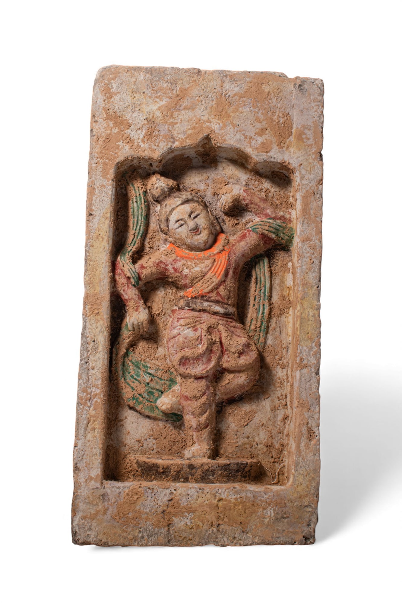CHINESE TERRACOTTA BRICK DEPICTING A DANCING FIGURE - TL TESTED: Northern Wei Dynasty, Ca. AD 386-534 A terracotta brick portraying a dancing figure. The figure is in a lively manner, dressed in flowing robes and a green shawl. Size: 335mm x 165mm; Weight: 3.15kg.