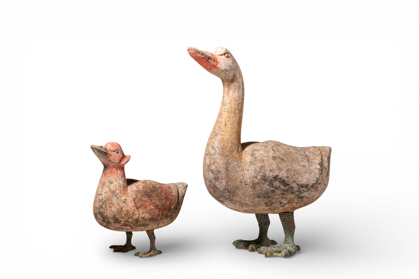 TWO CHINESE TERRACOTTA BIRDS - TL TESTED: Han Dynasty, Ca. 202 BC - AD 220 A group of two figures consisting a bird and a goose. The bird is painted predominantly in red, standing still with its head held up and supported by bronze legs. Furt