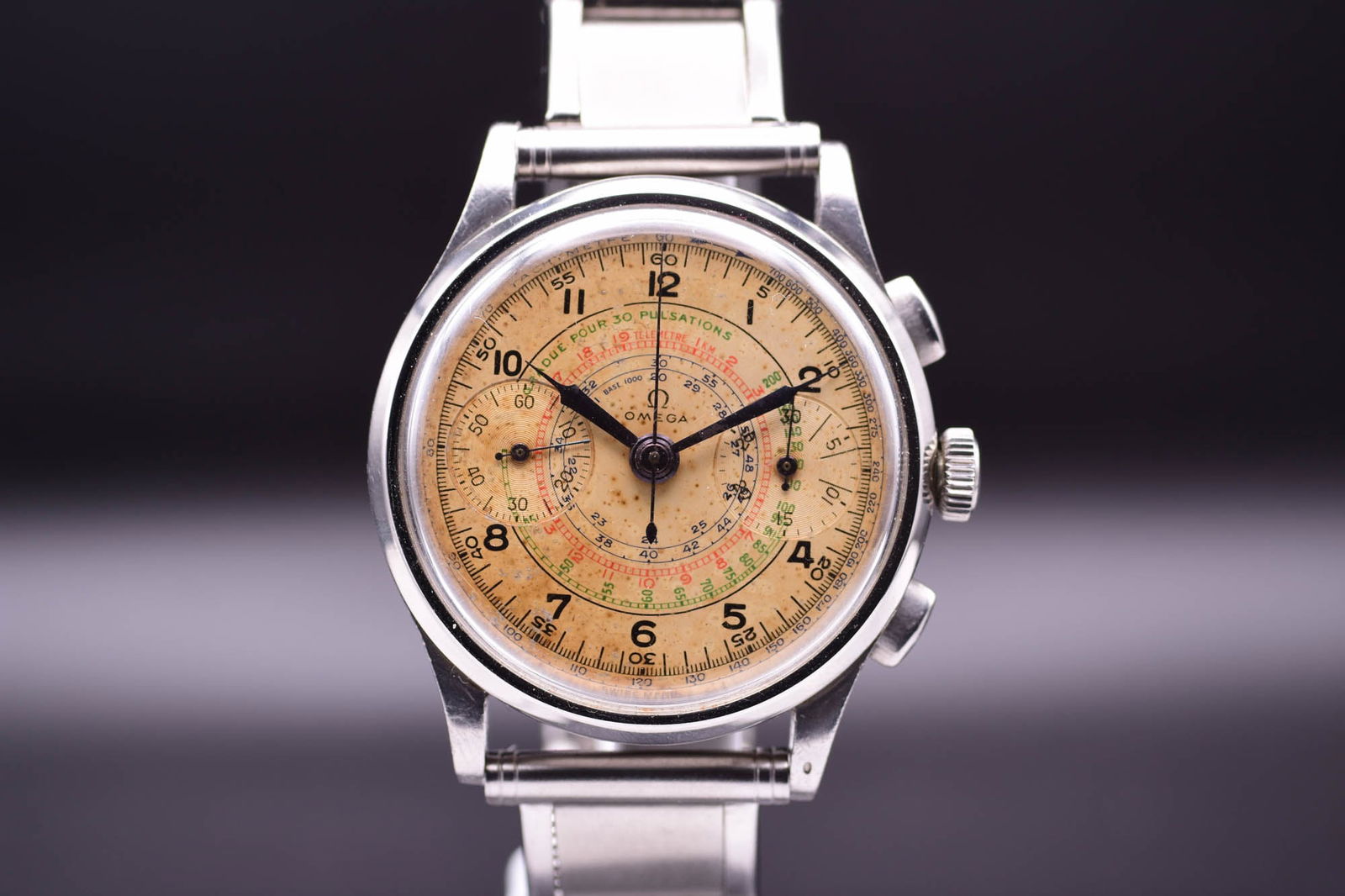 Omega Pre-Moonwatch Calibre 33.3 Chronograph Tropical Dial Highly Important Rare Men's Wristwatch c.: C.1940'sABA rare and historically significant vintage Omega Calibre 33.3 Chronograph, a piece coveted by horological enthusiasts for its oversized stainless steel case and the legendary manual-winding