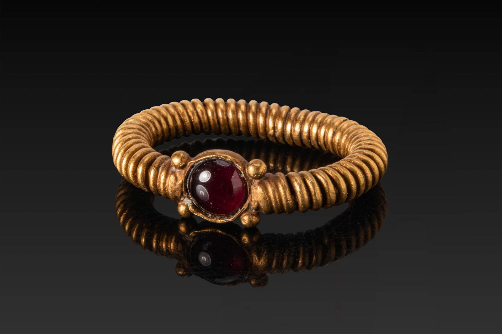 RARE PHOENICIAN HIGH KARAT GOLD COILED RING WITH RED GARNET CABOCHON AND PELLETS (1 of 4)