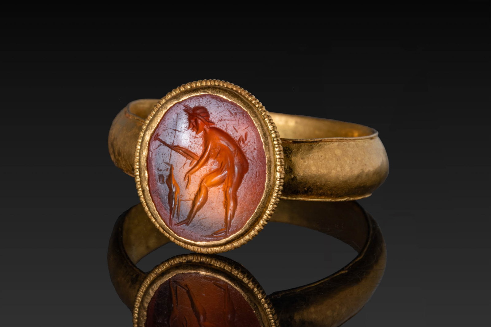 ROMAN HIGH KARAT GOLD RING WITH CARNELIAN INTAGLIO OF SOL INVICTUS (1 of 7)
