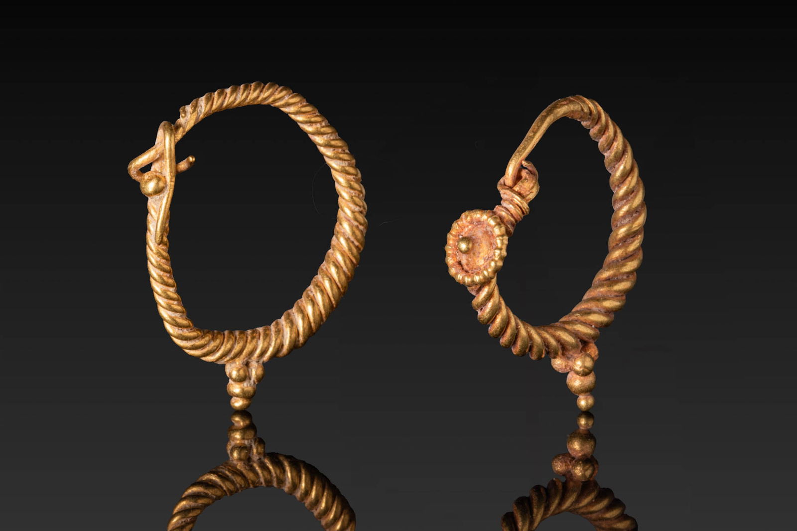 PAIR OF HELLENISTIC HIGH KARAT GOLD TWISTED EARRINGS (1 of 3)