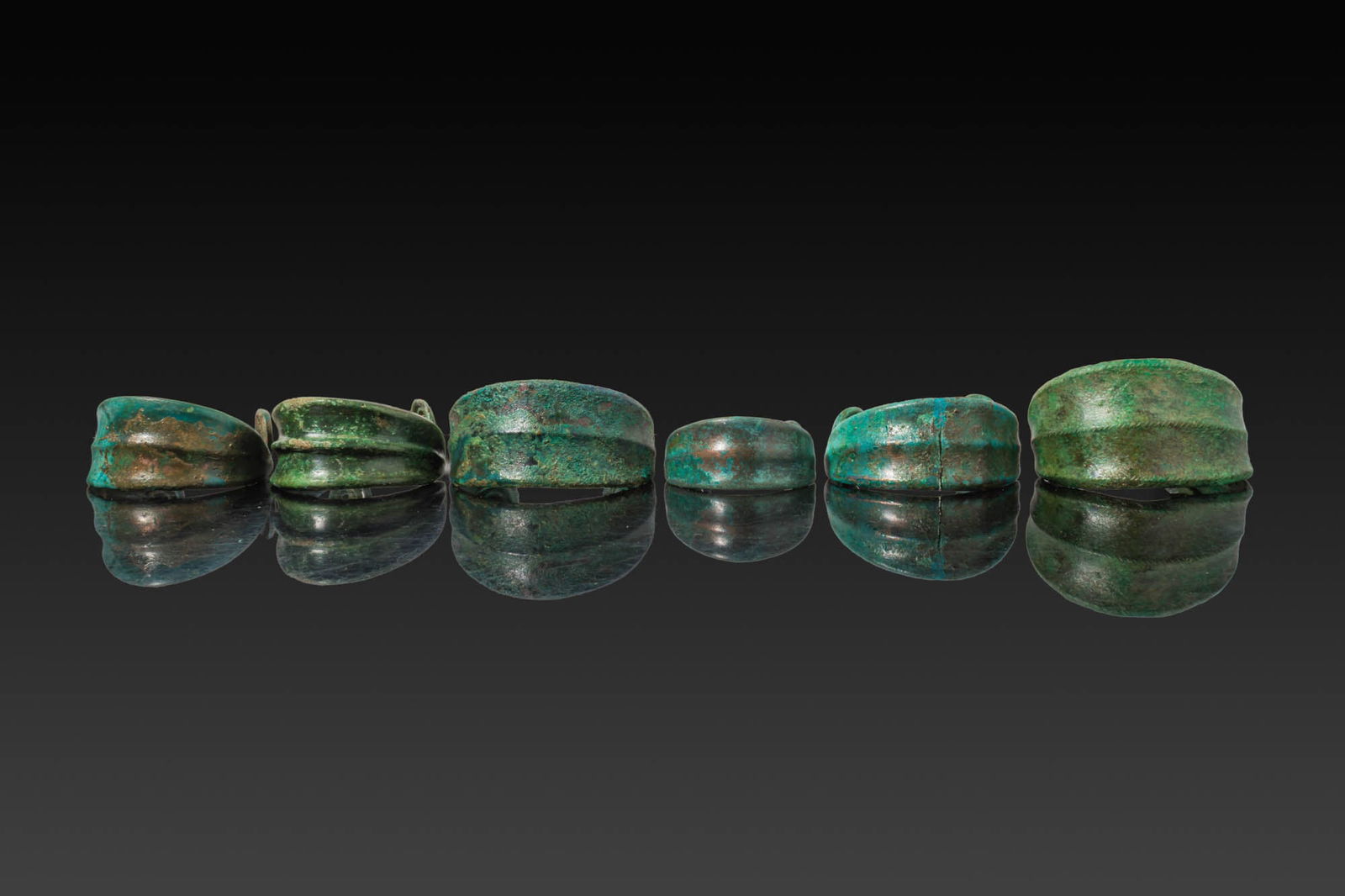 COLLECTION OF BRONZE AGE BRACELETS WITH SPIRAL TERMINALS (1 of 3)