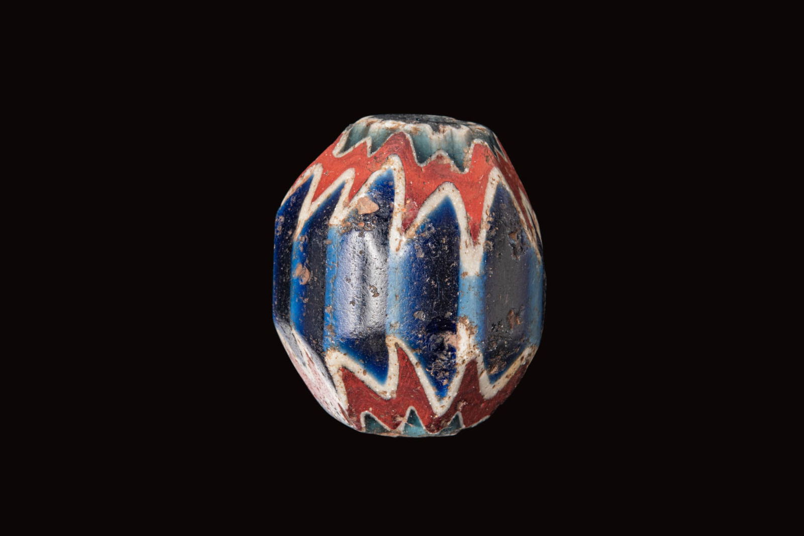 LARGE VENETIAN SIX-LAYERED GLASS BEAD: Ca. AD 1800 - 1830 . A blue glass bead of ovoid form, with faceted ends revealing six layers in red, white and blue. Size: 35mm x 32mm; Weight: 48g Provenance: Prince collection, 1990s-2014; Ex. Priva