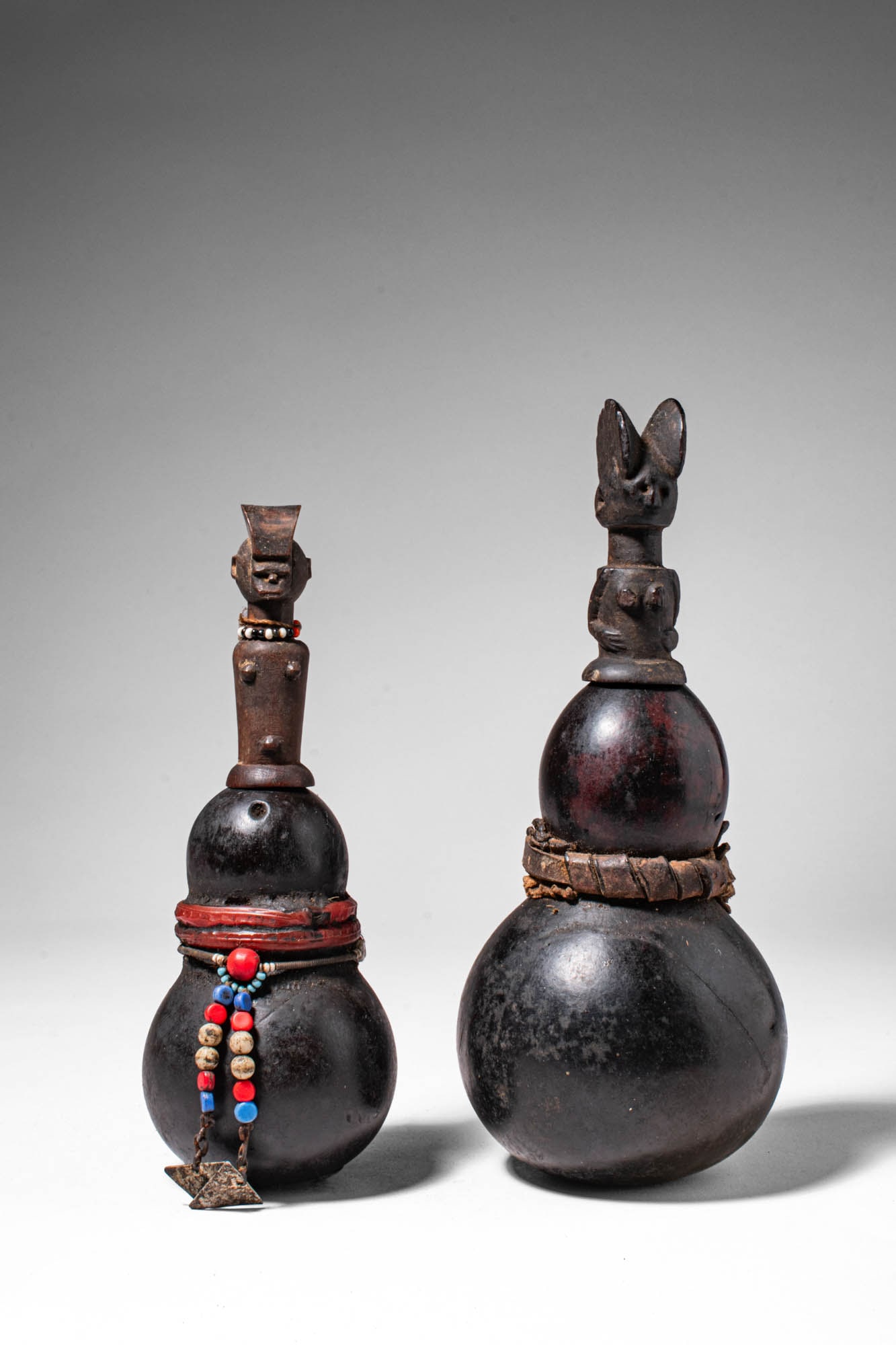 PAIR OF CALABASH VESSELS WITH FIGURATIVE STOPPERS (1 of 8)