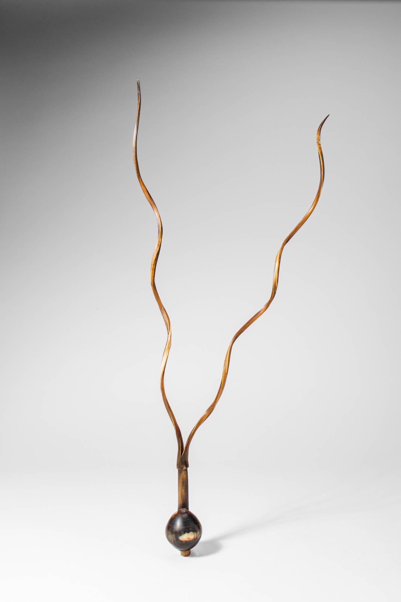 ZULU SNUFF CONTAINER: Ca. 19th - 20th century AD. A snuff container formed with a tapered body terminating in a narrow neck, the vessel is fitted with two long, slender prongs rising upward in a graceful bifurcated form.Si