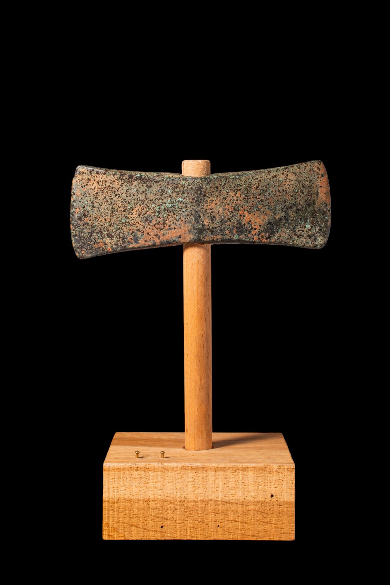 RARE MINOAN DOUBLE AXE HEAD - LABRYS: Ca. 1600 - 1400 BC. A fine and very rare bronze double axe head with opposing wedge-shaped blades flaring from a thickened central socket with a circular hafting eye. For similar see: The Metropolitan