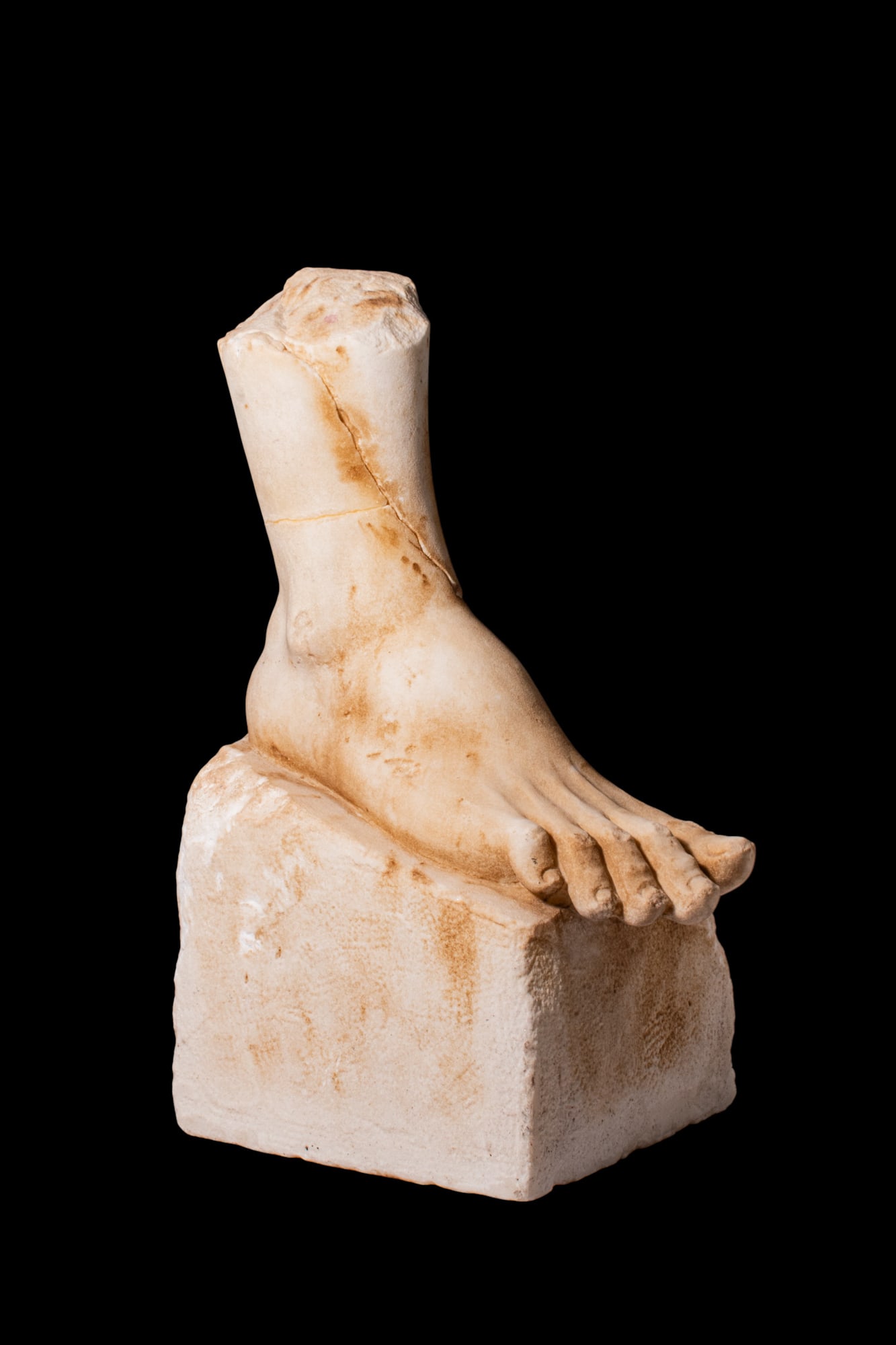 ROMAN MARBLE LIFE-SIZE FOOT OF GOD OR HERO: Ca. AD 100 - 200. A finely carved marble foot fragment, rendered with considerable anatomical sensitivity, the slender toes articulated with naturalistic separation and delicately defined nail beds. T