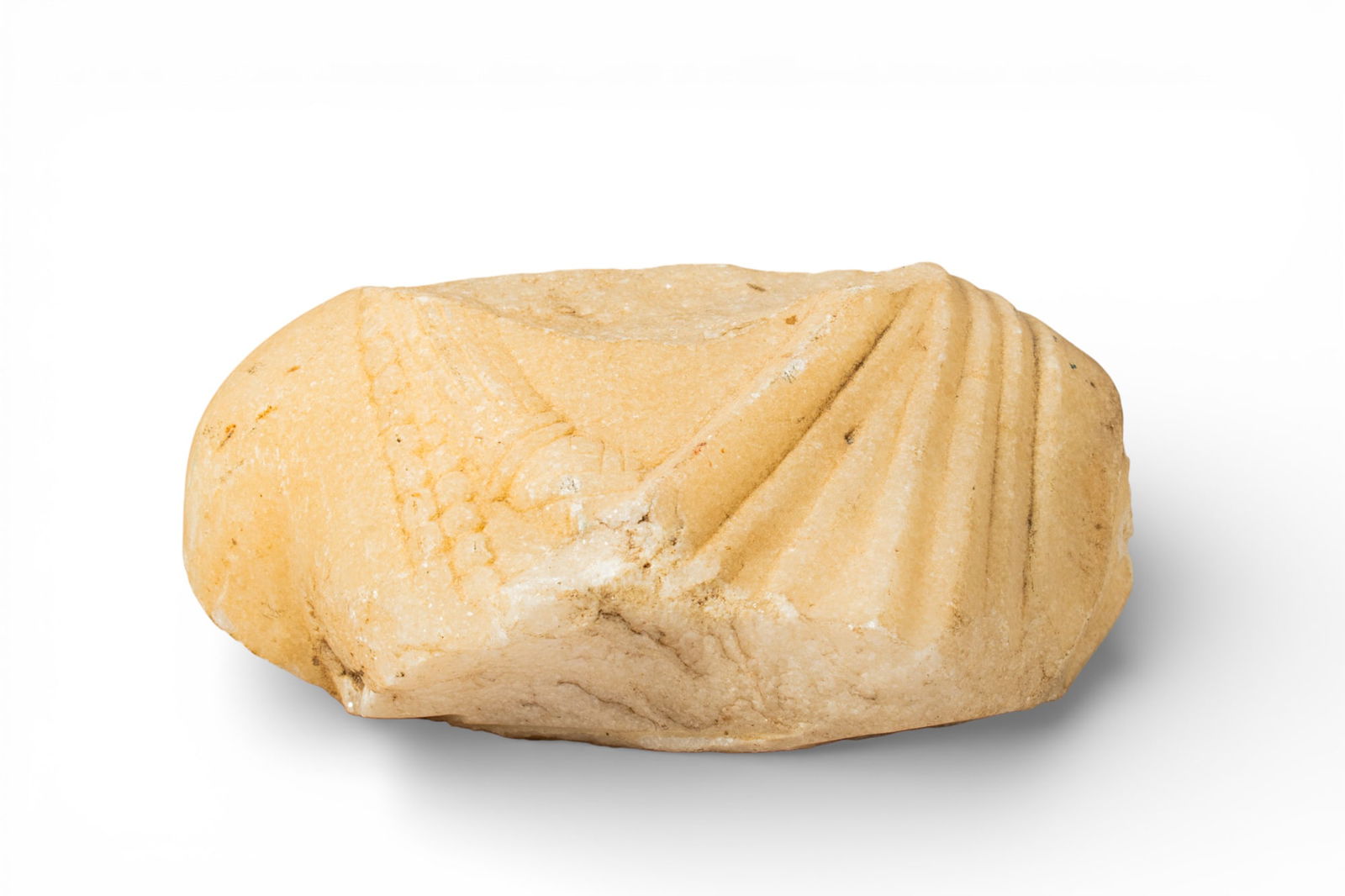 EASTERN ROMAN EMPIRE MARBLE BUST OF A GODDESS OR NOBLEWOMAN: Ca. AD 100 - 200. A marble fragment comprising the upper torso of a goddess or noblewoman, the garment rendered with diagonal folds gathered at the shoulder, the reverse roughly flattened. For similar