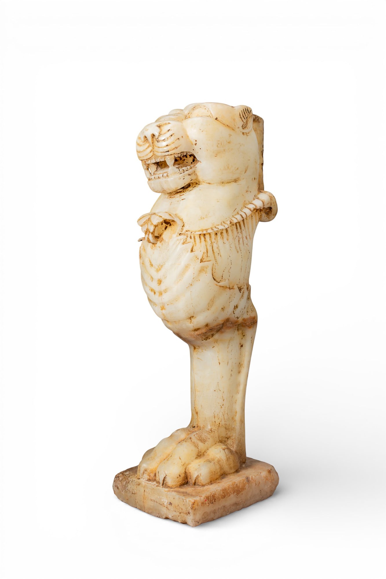 EASTERN ROMAN EMPIRE ALABASTER LION MONOPODIUM TABLE LEG: Ca. AD 200 - 400. A carved alabaster monopodium leg, set on a rectangular plinth and carved with a paw modelled in the round with splayed toes and incised claws. A single leg rises from the paw, carve