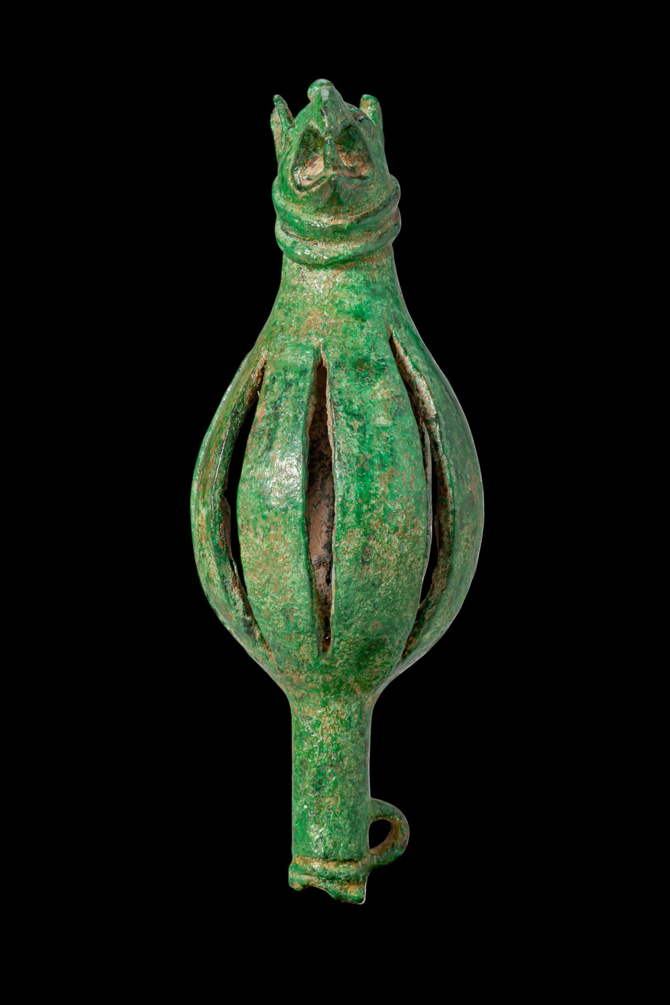 STUNNING ETRUSCAN BRONZE BELL WITH DRAGON HEAD: Ca. 600 - 400 BC. A bronze bell with an openwork ovoid body tapering to a short tubular terminal with a side loop. The upper section is cast as a dragon head with an open mouth, the neck encircled by