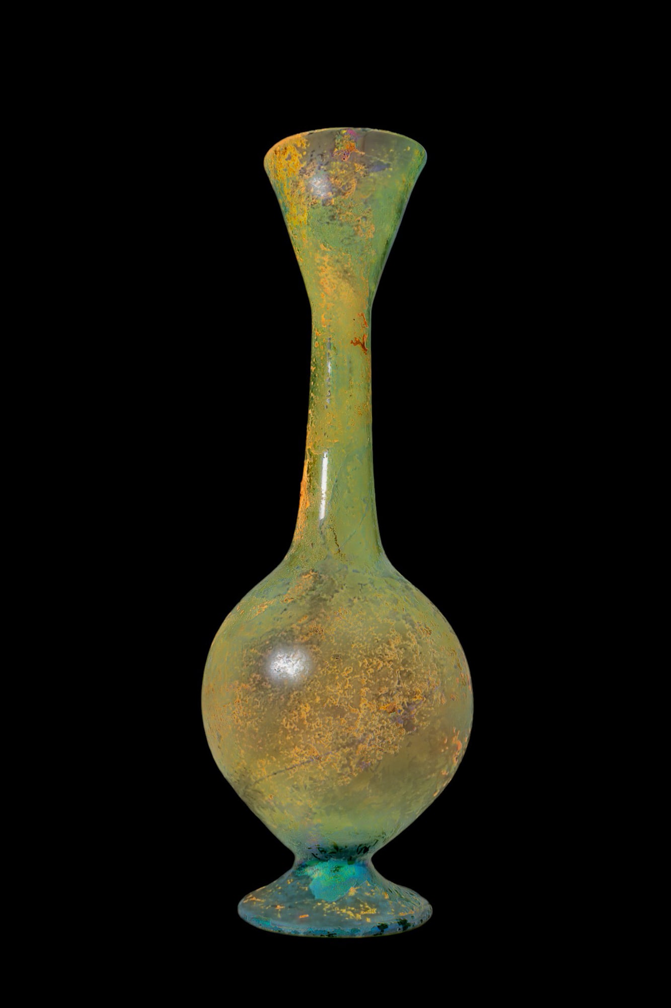 TALL ROMAN GLASS VASE: Ca. AD 200 - 400. A tall, pale green glass vase with a globular body on a spreading circular foot. A long, slender neck rises to a flaring funnel mouth. Size: 255mm x 95mm; Weight: 155g Provenance: Pr