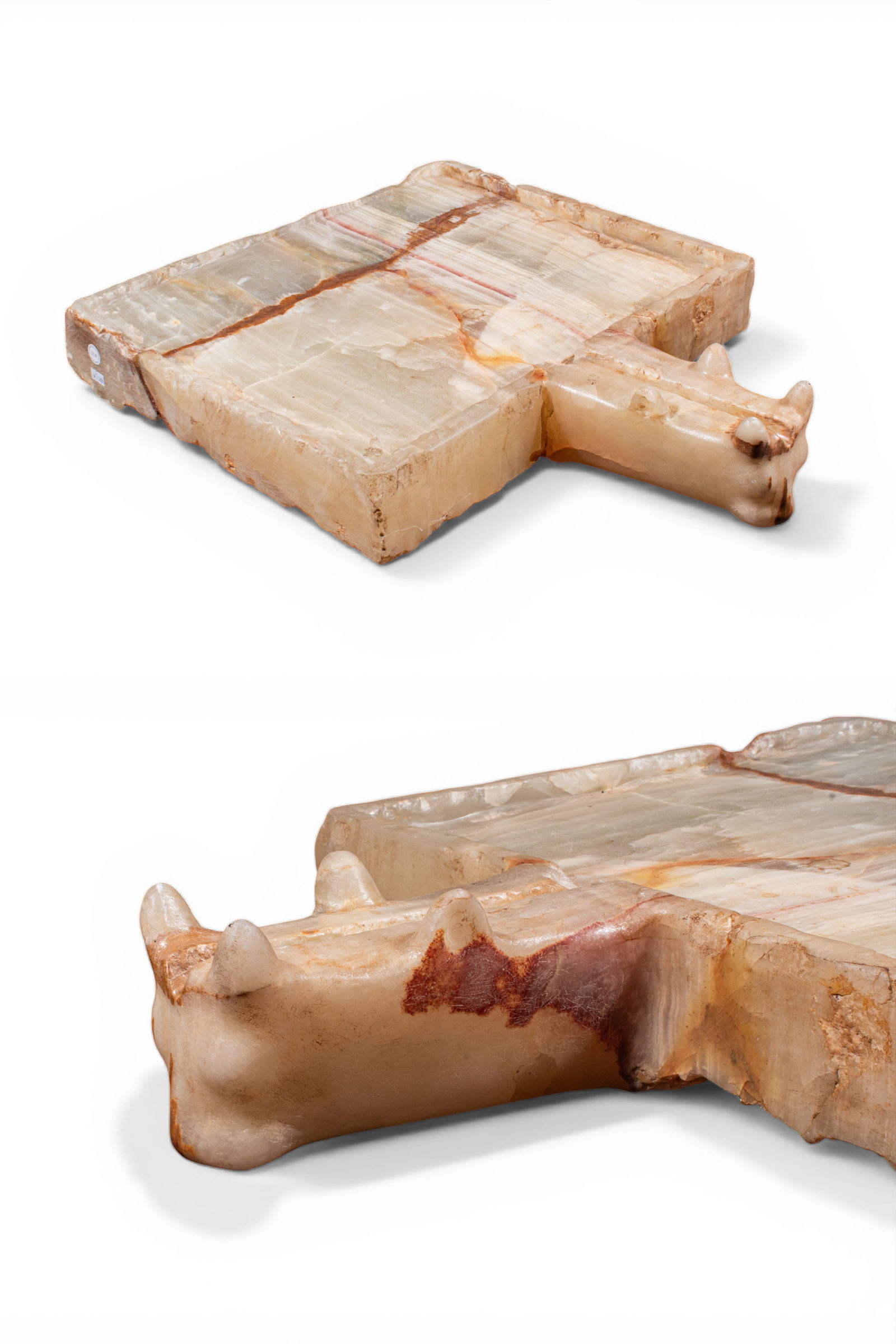 MONUMENTAL SOUTH ARABIAN ALABASTER OFFERING TABLE: Ca. 300 - 100 BC. A carved alabaster offering table of square plan, the upper face cut with a shallow recessed field within a raised border. One side extends to a narrow spout with a central channel,
