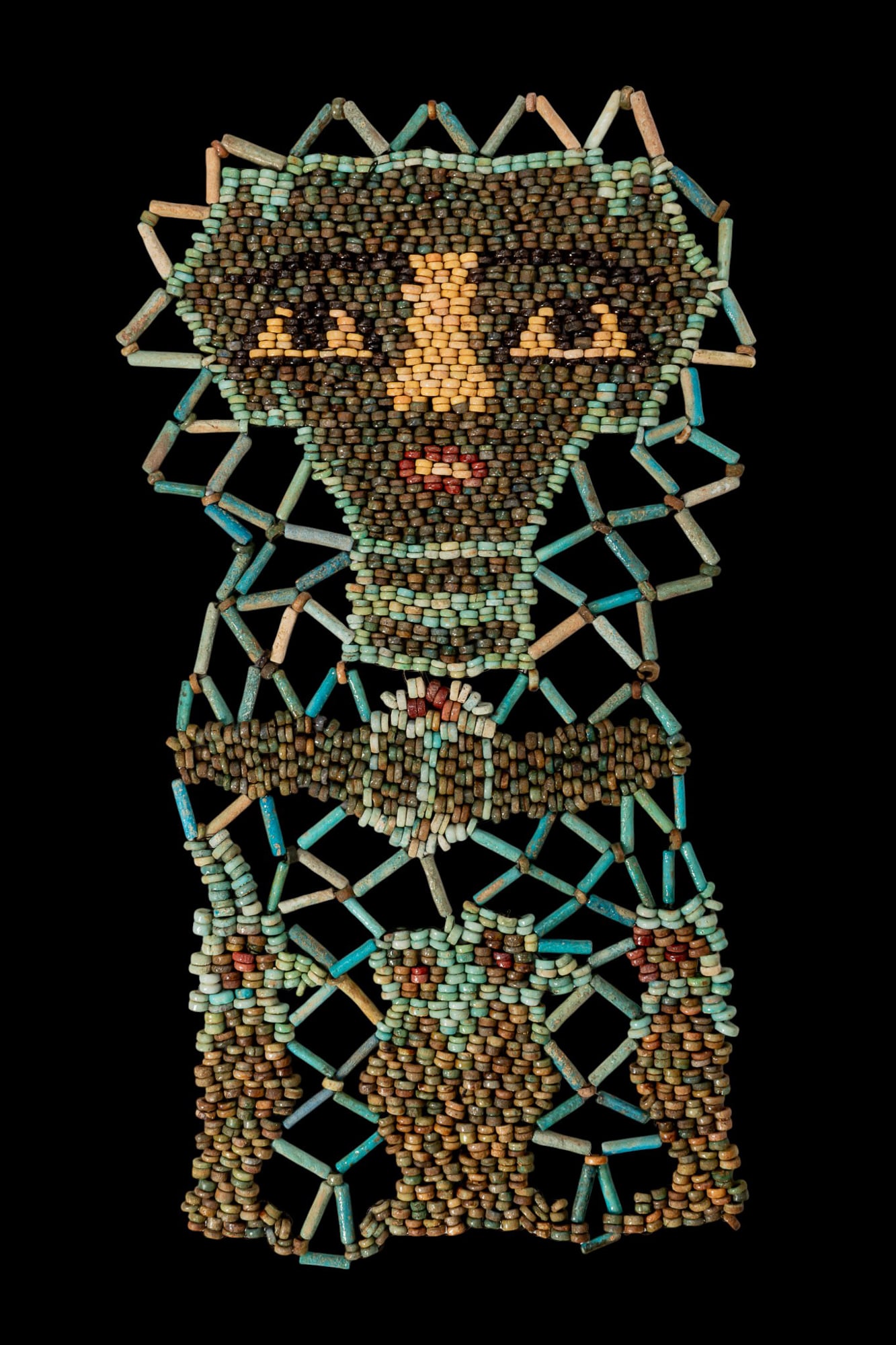 EGYPTIAN FAIENCE SHROUD WITH WINGED SCARAB AND SONS OF HORUS: Late Period, Ca. 664 - 30 BC. A restrung shroud composed of threaded disc-shaped and tubular faience beads arranged as an openwork panel, depicting the deceased?s face, a winged scarab, and the four S