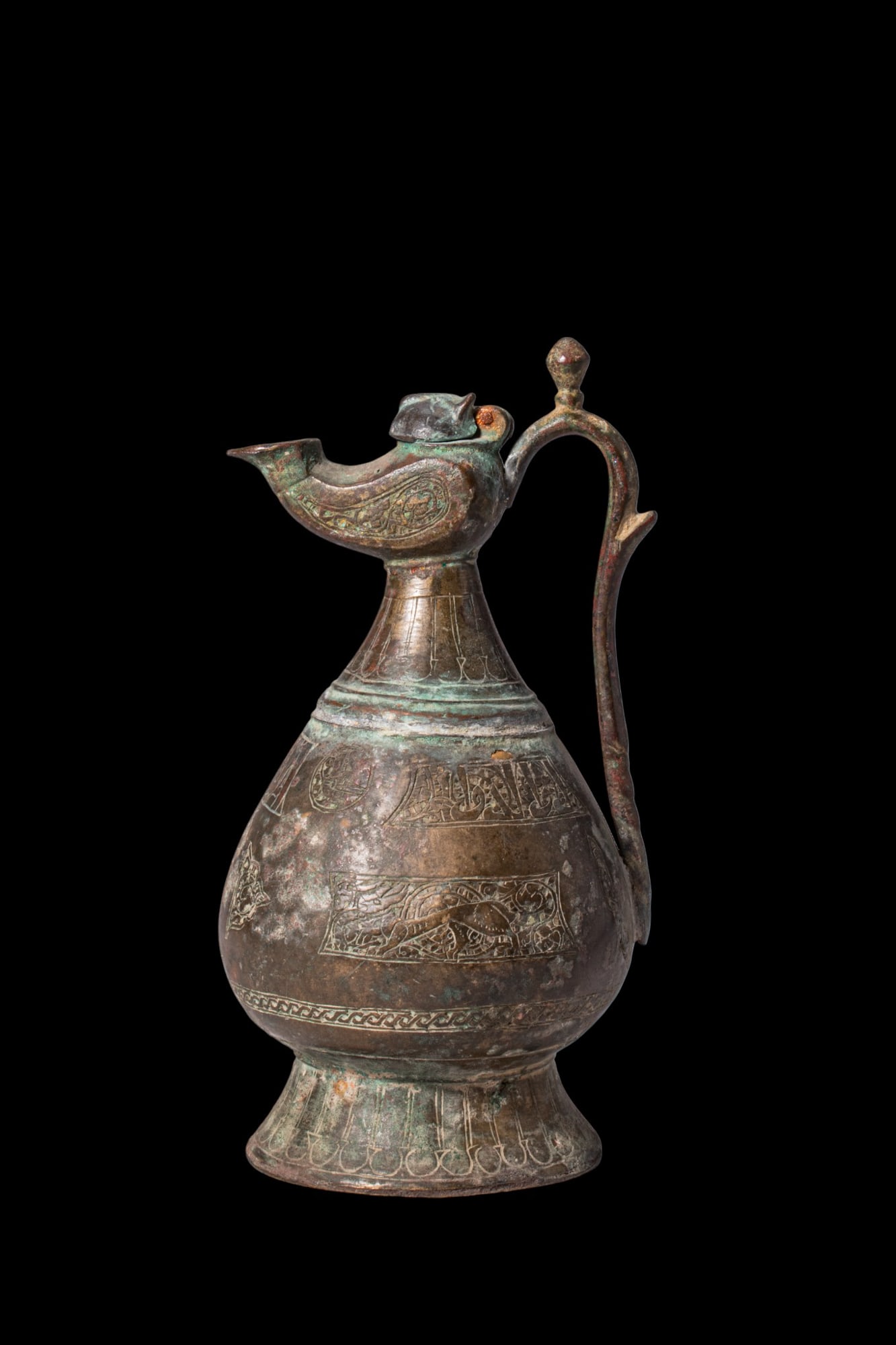 SELJUK BRONZE PEAR-SHAPED EWER WITH LAMP SPOUT AND ENGRAVED DECORATION (1 of 6)
