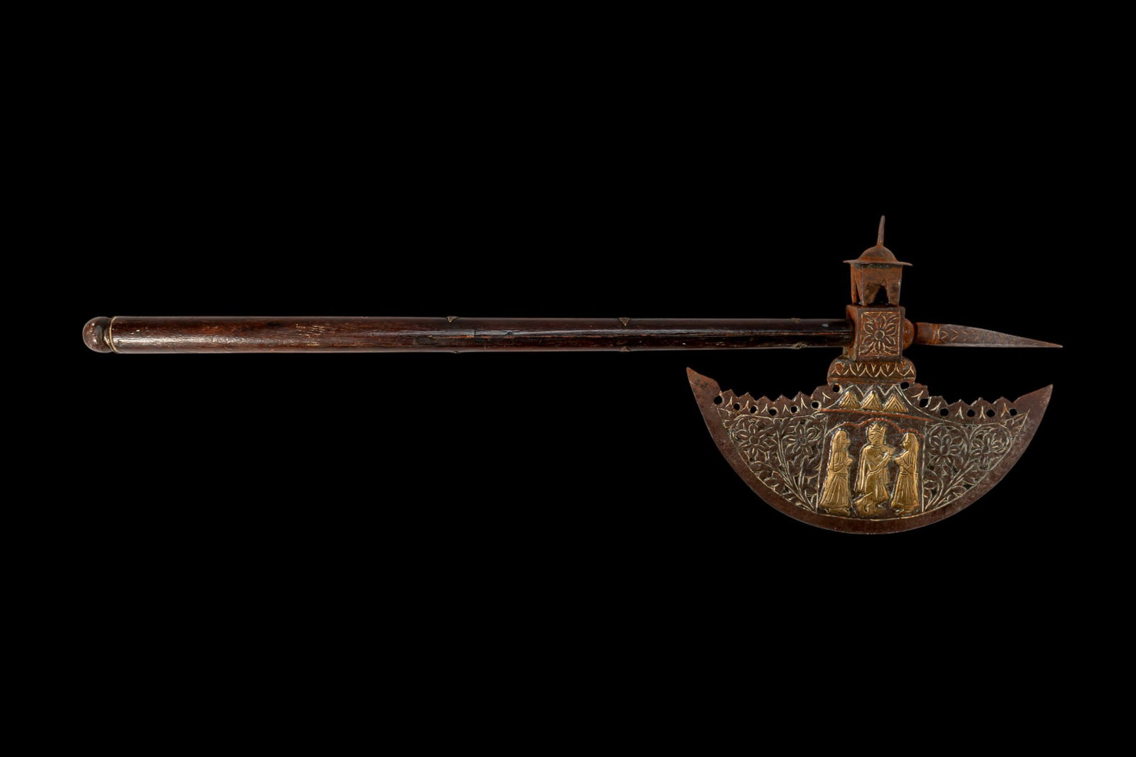 INDO-PERSIAN TABAR AXE WITH BRASS INLAY: Ca. AD 1800 - 1900. A tabar axe with a crescent-shaped head with a square-block socket, surmounted by a small architectural finial and a rear-pointing spike. A pierced crest runs along the upper edge