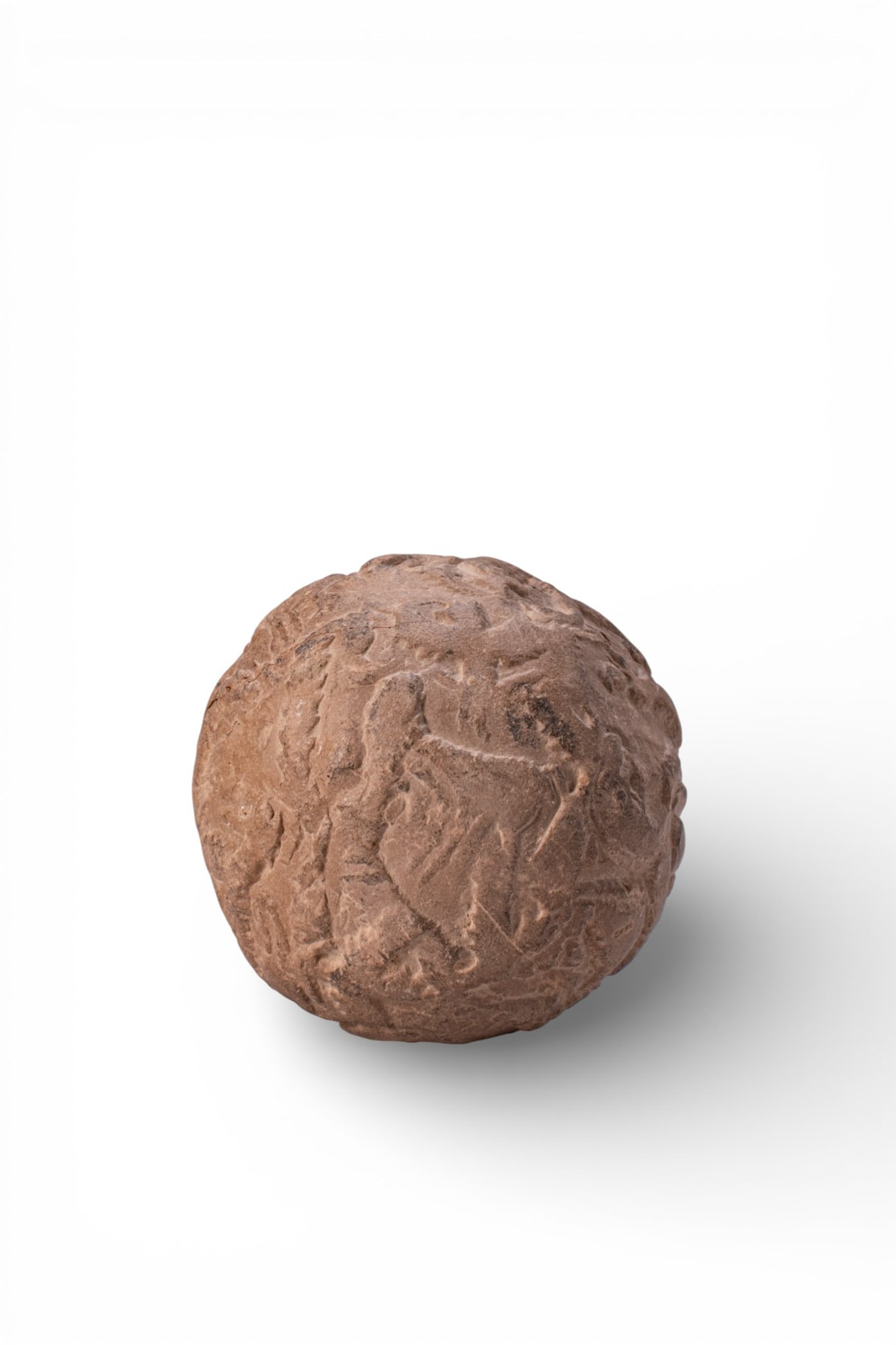 URUK PERIOD CLAY SPHERE WITH QUADRUPED FRIEZE: Ca. 3500 BC. A clay sphere decorated in low relief with stylised quadrupeds arranged in procession around the circumference. Size: 55mm x 55mm; Weight: 120g Provenance: Private London collection, form