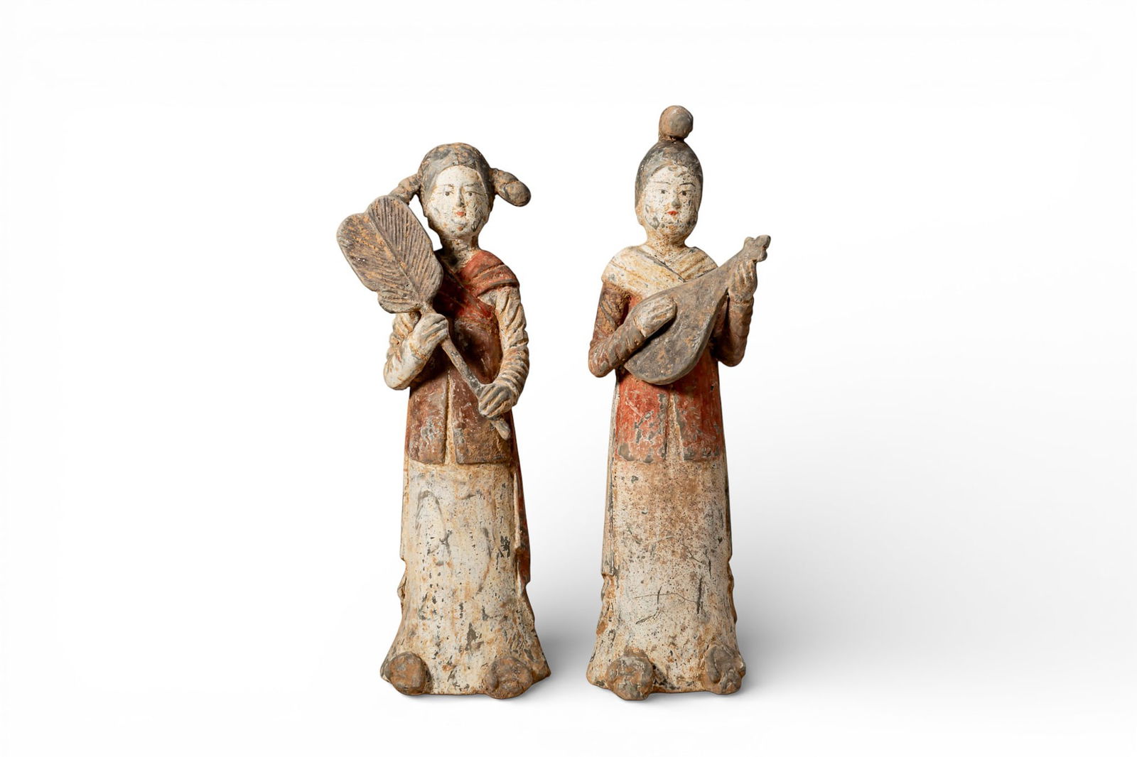 PAIR OF CHINESE TERRACOTTA FEMALE FIGURES - ATTENDANT AND MUSICIAN - TL TESTED: Tang dynasty, Ca. AD 618 - 907. A pair of hollow-moulded terracotta female figures. Each is depicted standing upright and dressed in a short jacket over a long under-robe, with a shawl across the shou
