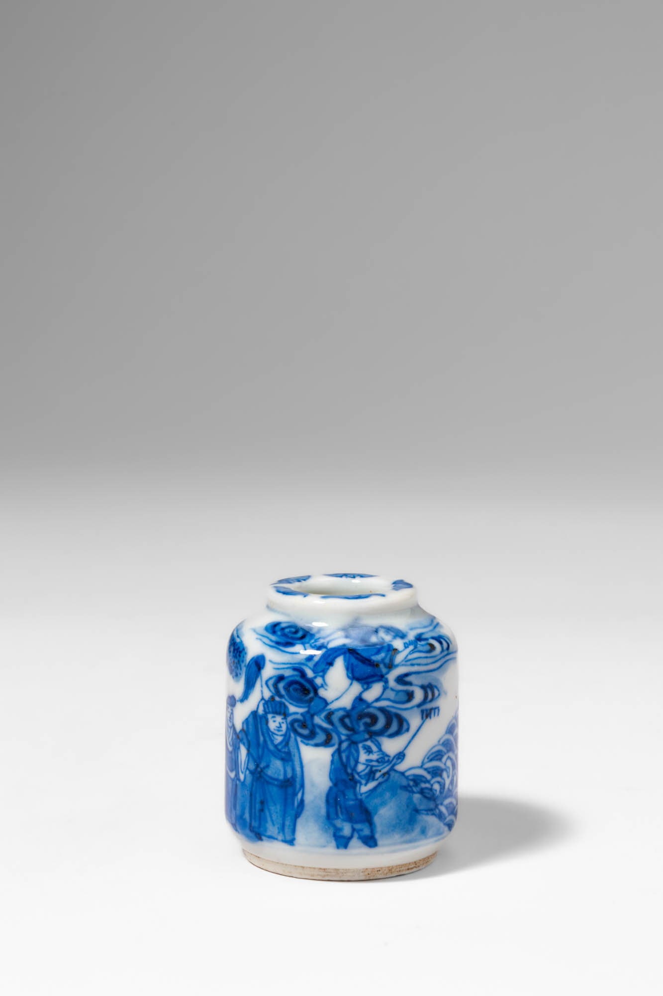 CHINESE BLUE AND WHITE SNUFF BOTTLE, DEPICTING SCENE FROM JOURNEY TO THE WEST: Qing Dynasty, Ca. AD 1644 - 1912. >A porcelain snuff bottle of rounded cylindrical form with a short neck, decorated in underglaze cobalt blue on a white ground with a lively narrative scene drawn fro
