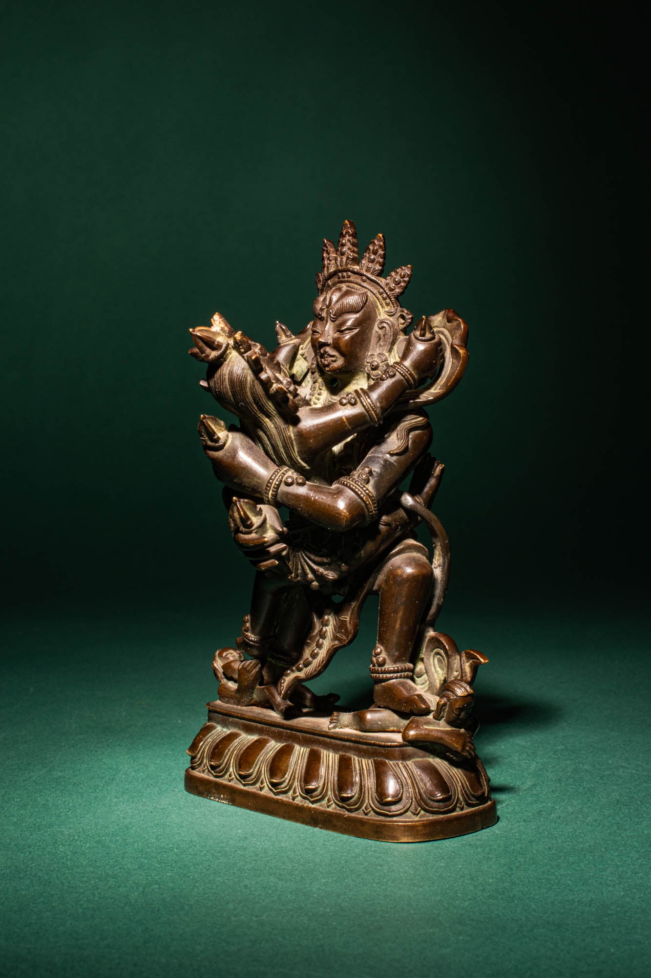 SINO-TIBETAN BRONZE YABYUM OF VAJRASATTVA AND CONSORT: Qianlong Period, Ca. AD 1736 - 1795. > A cast Sino-Tibetan bronze group depicting Vajrasattva in yab-yum (union) with his consort, seated in vajraparyankasana upon a double-lotus base. The principal d