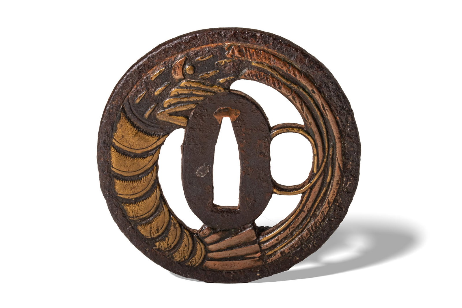JAPANESE IRON TSUBA WITH SHRIMP DETAIL: Edo Period, Ca. AD 1603 - 1868. An iron tsuba boldly inlaid with gold and copper to depict a stylised shrimp coiled around the seppa-dai. Size: 78mm x 78mm; Weight: 145g. Provenance: Prince collection