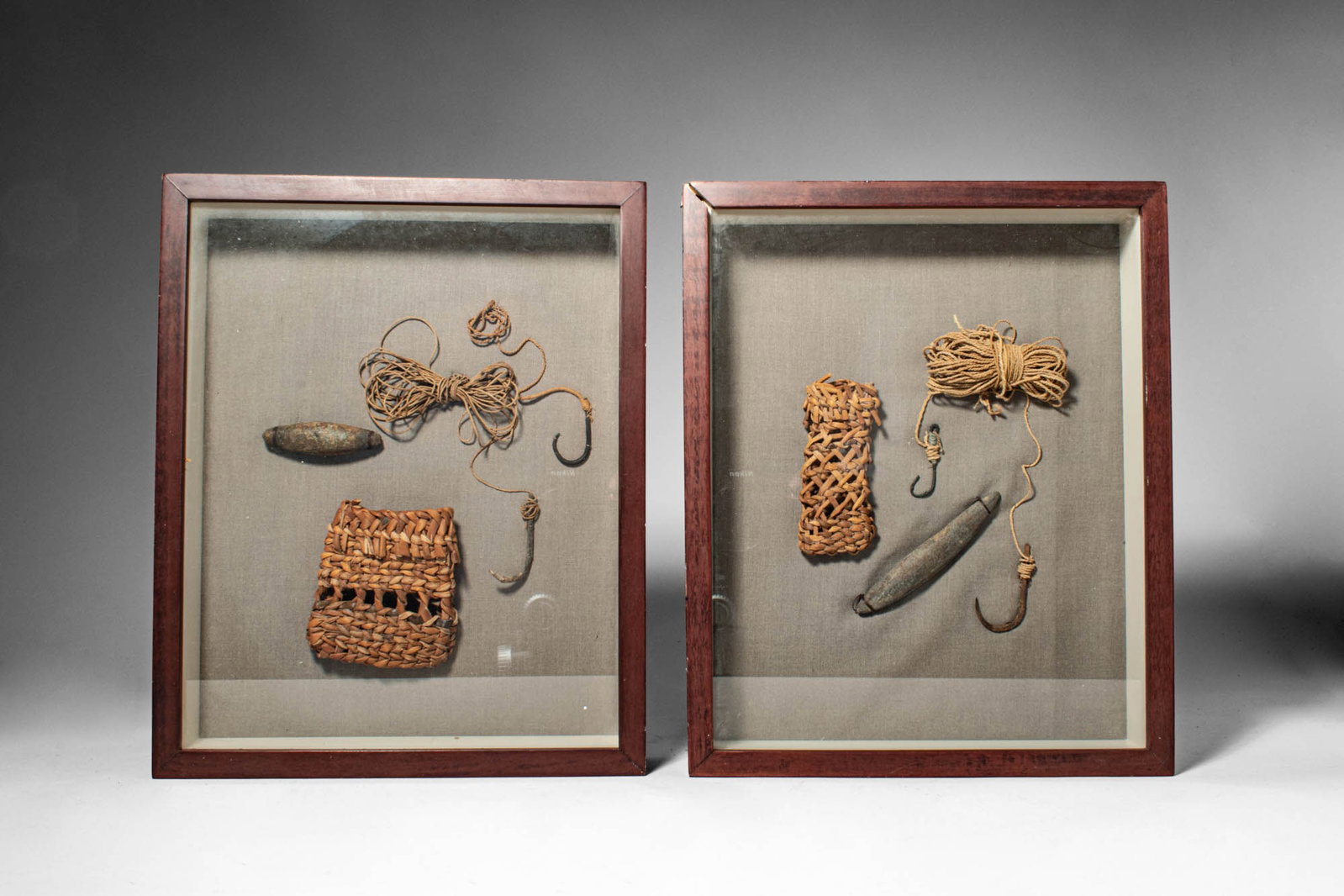 SET OF CHILEAN FISHING IMPLEMENTS, ARICA: Ca. late 19th - early 20th century AD. >A collection of two framed groups of traditional fishing equipment, each set including fibre cordage, hooks, sinkers, and woven components. The hooks are of cur