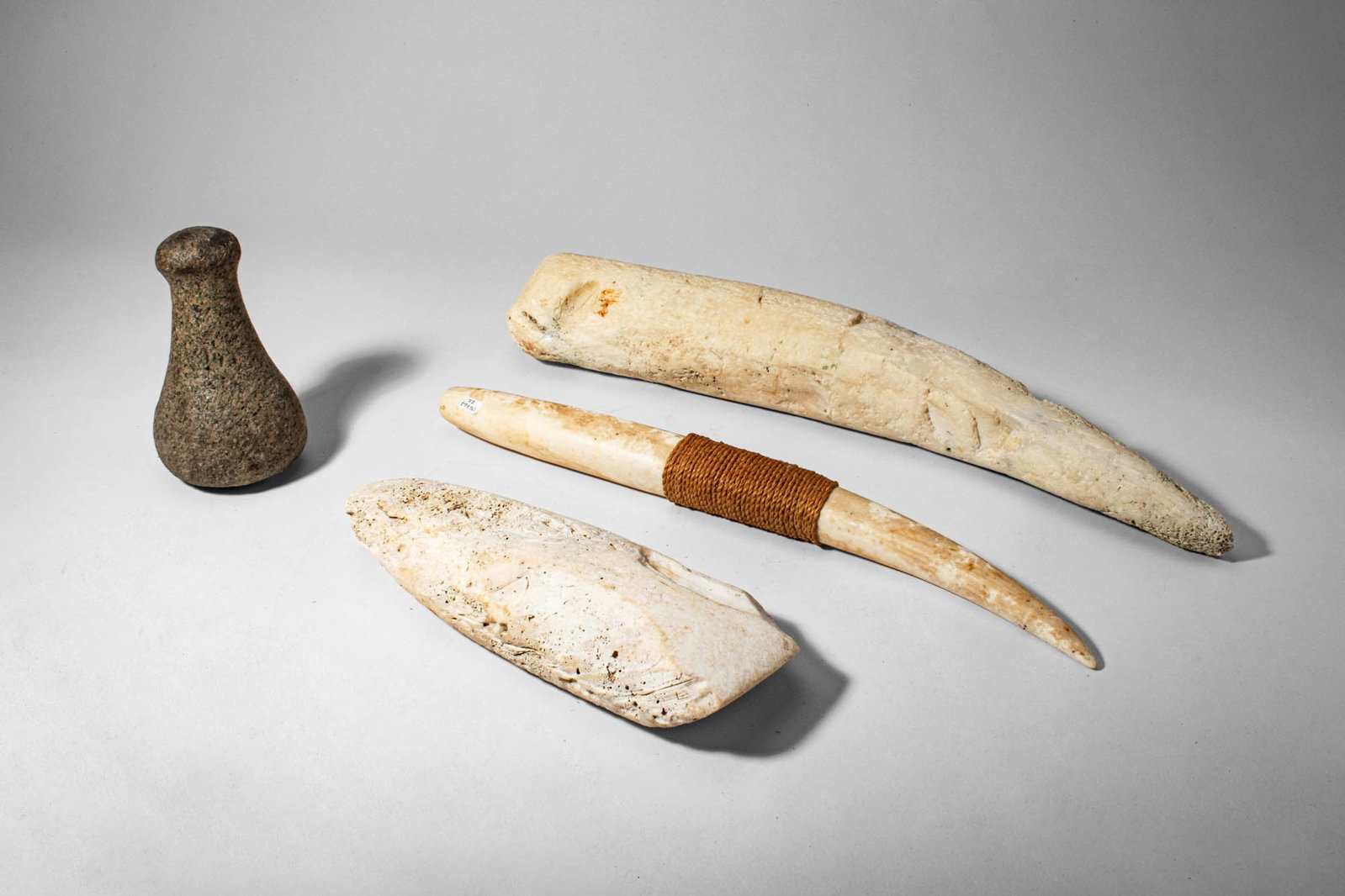 GROUP OF MICRONESIAN STONE PESTLES AND MORTAR (1 of 3)
