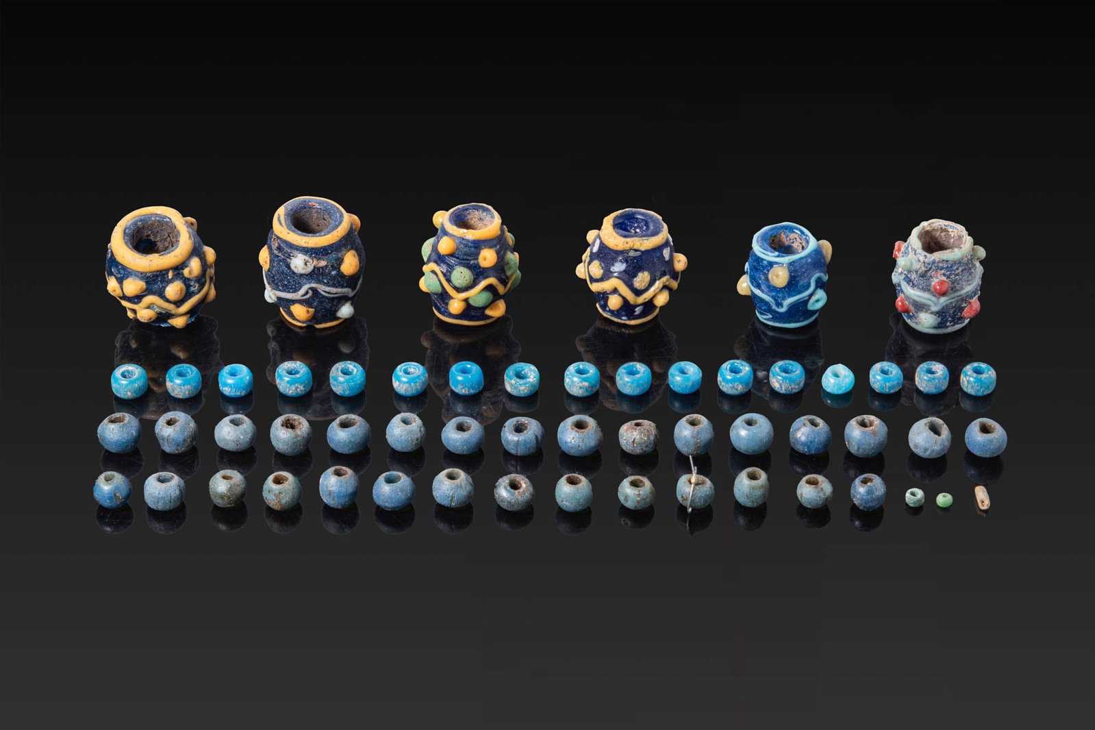 COLLECTION OF GLASS PHOENICIAN BEADS (1 of 3)