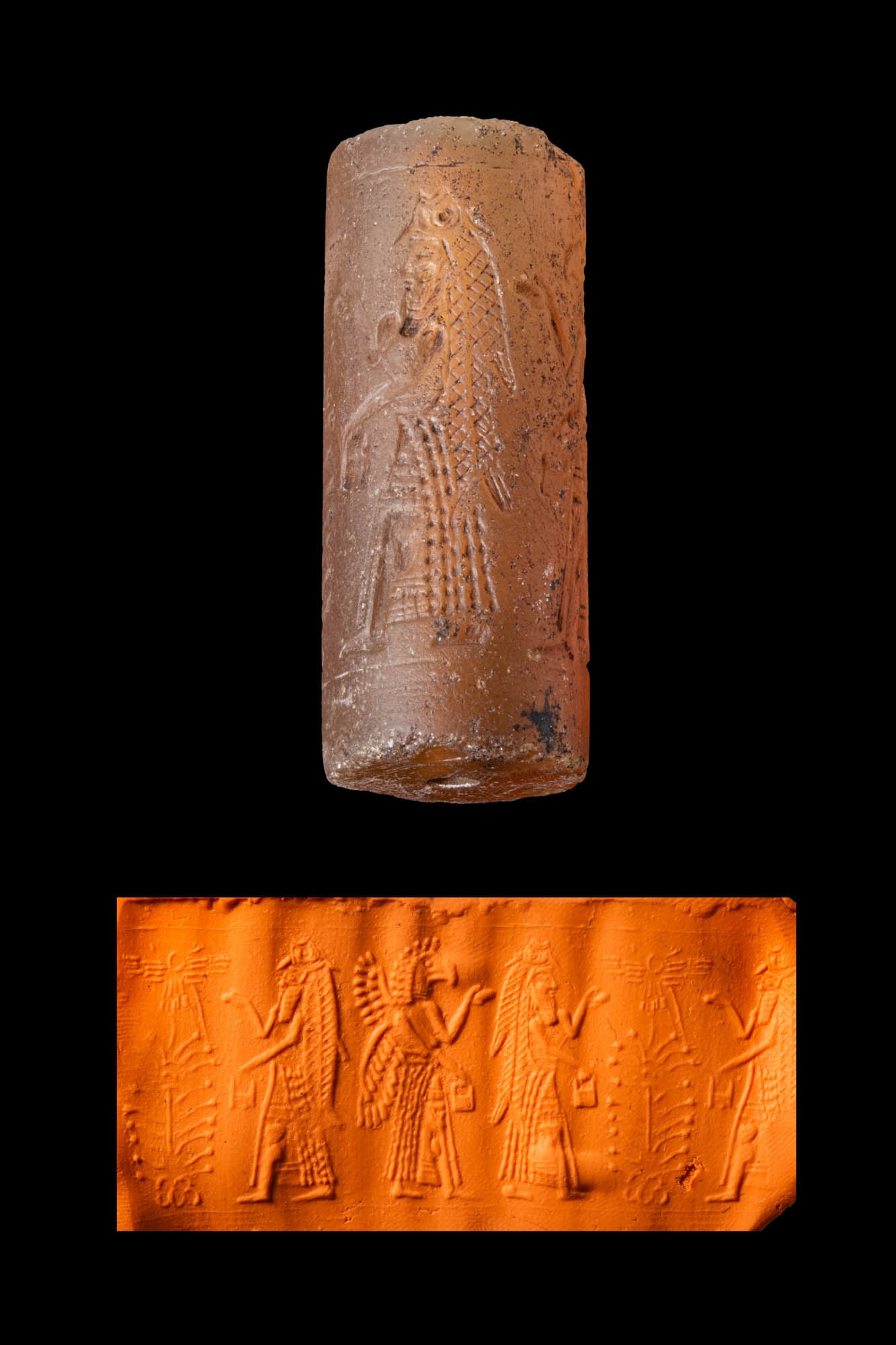 NEO-ASSYRIAN TRANSLUCENT STONE CYLINDER SEAL WITH HYBRID GENII AND A TREE OF LIFE (1 of 5)