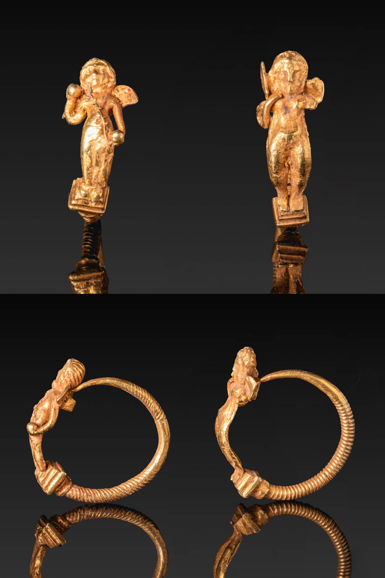 MATCHED PAIR OF HELLENISTIC GOLD EARRINGS WITH WINGED EROS: Ca. 200 - 100 BC. A matched pair of gold earrings, each with a circular twisted hoop finished with a winged Eros on a stepped plinth. The nude figure stands frontally, with one arm bent and the other 