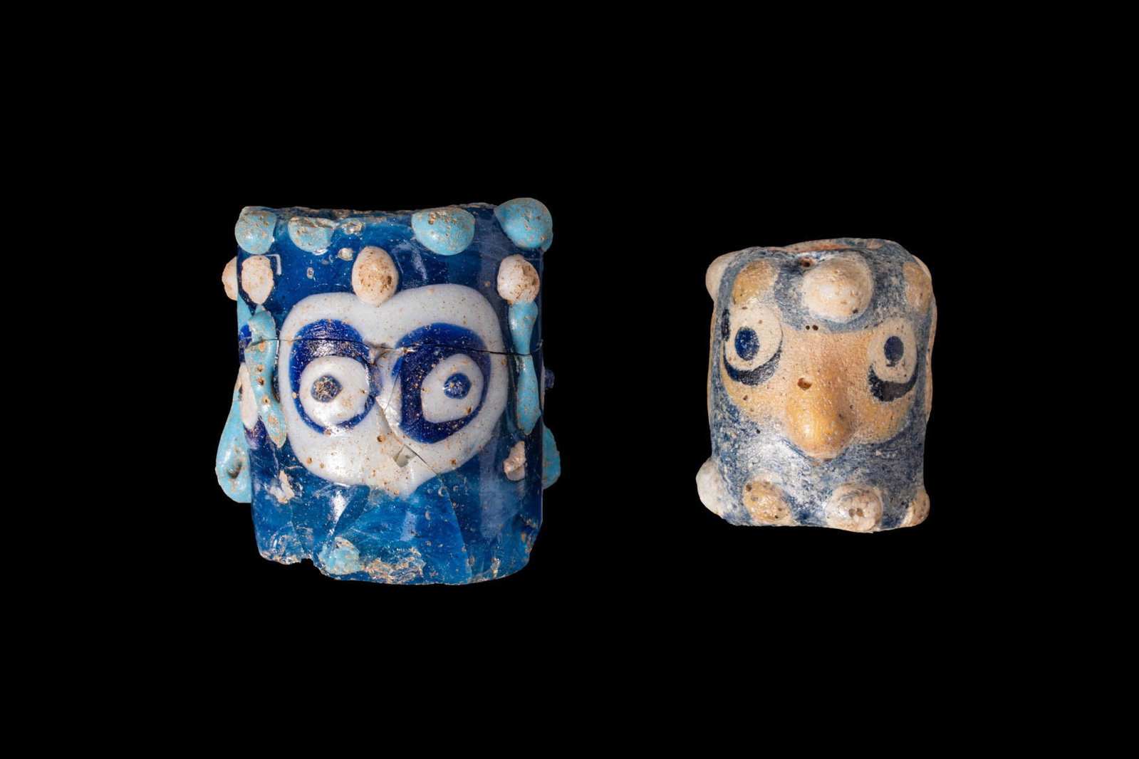 PAIR OF PHOENICIAN GLASS FACE BEADS (1 of 3)