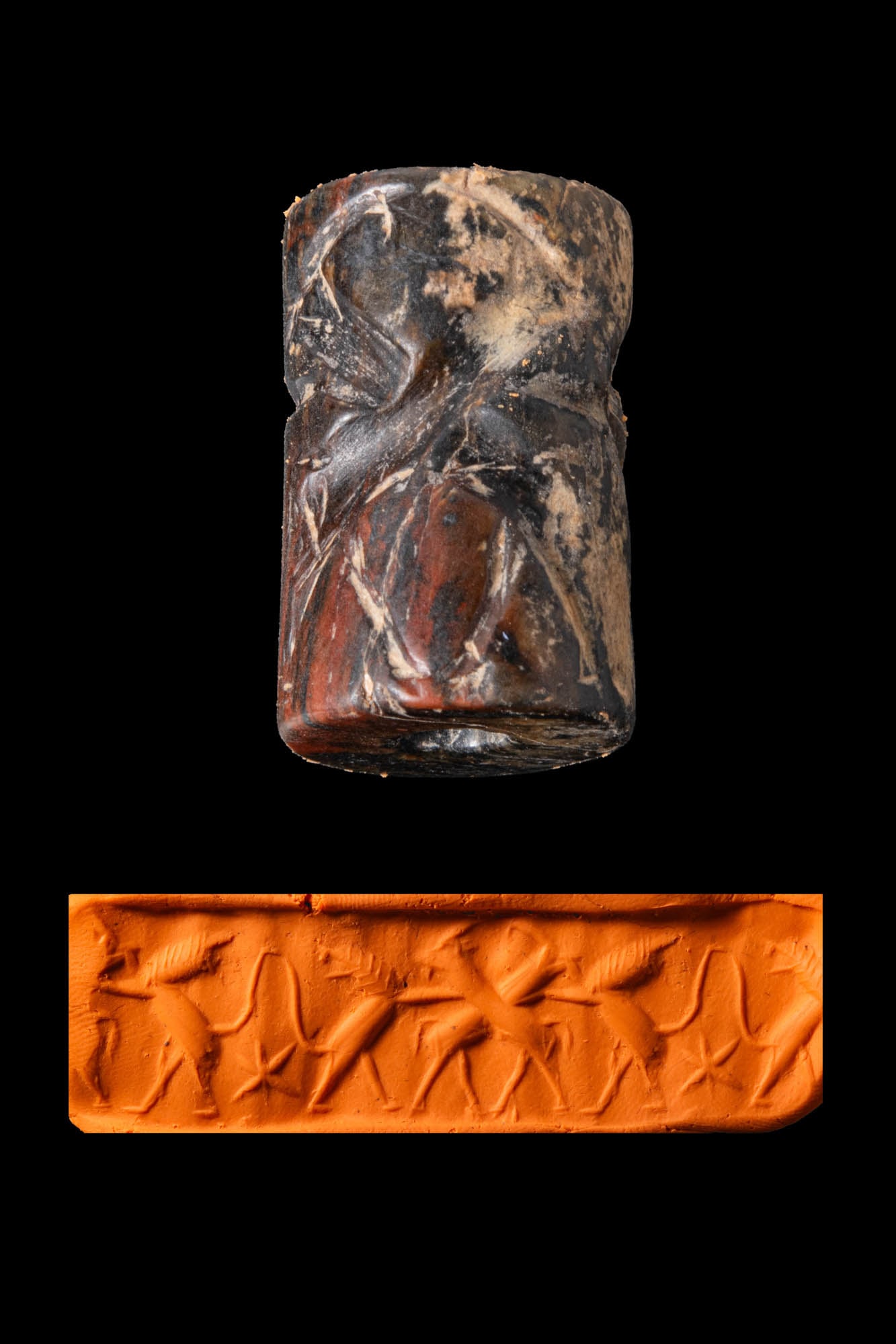 EARLY DYNASTIC MESOPOTAMIAN REDDISH-BROWN STONE CYLINDER SEAL WITH LIONS AND IBEXES (1 of 5)