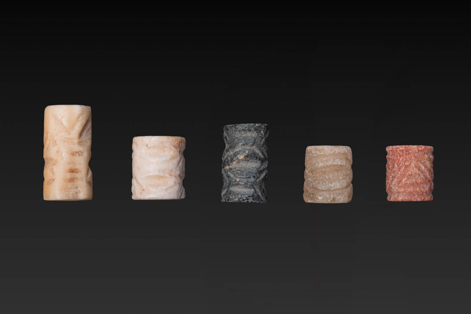 COLLECTION OF JEMDET NASR STONE CYLINDER SEALS WITH GEOMETRIC MOTIFS (1 of 3)
