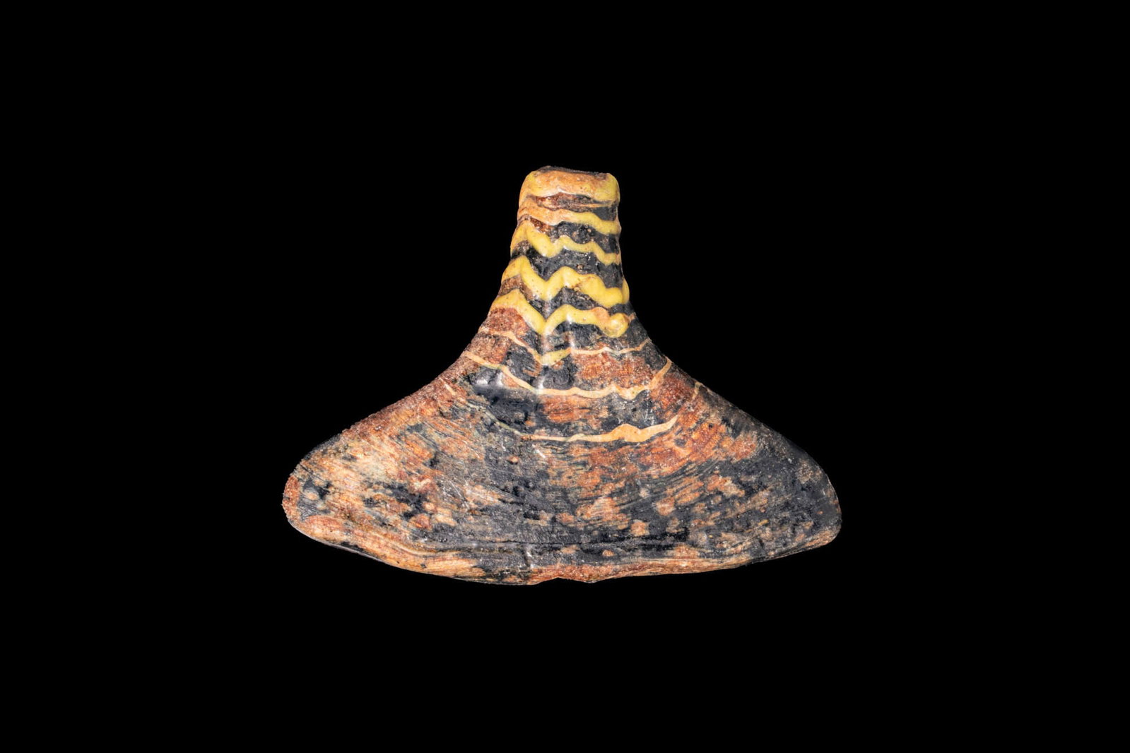 PAIR OF GRAECO-EGYPTIAN CORE-FORMED GLASS PAPYRUS FLOWER-SHAPED PENDANTS: Ca. 332 - 30 BC. A pair of core-formed glass papyrus flower-shaped pendants, each with a broad triangular body and a tapering neck, pierced lengthwise. The one on the left has a dark ground decorated 