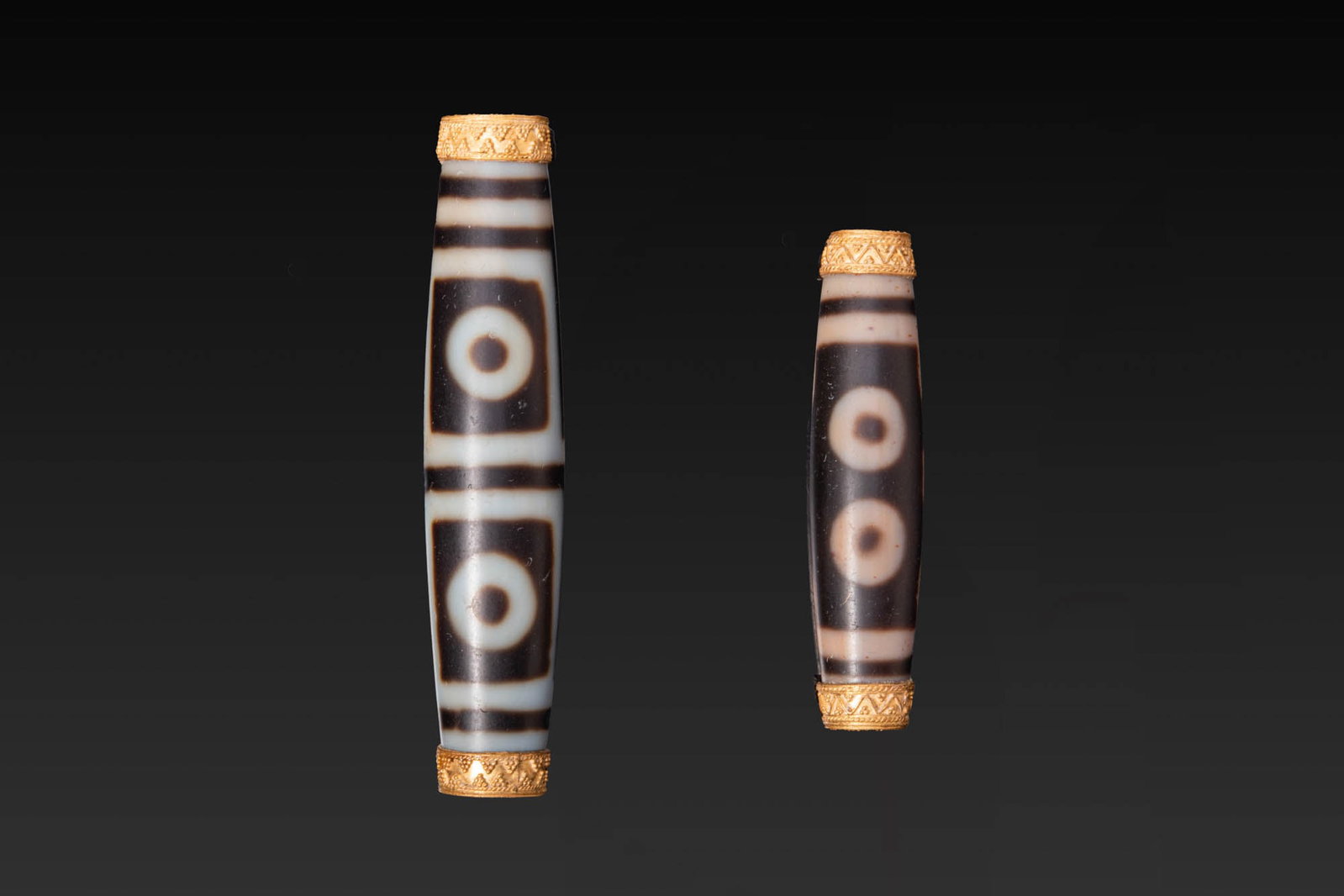 PAIR OF LARGE TIBETAN AGATE DZI BEADS WITH GOLD CAPS (1 of 3)
