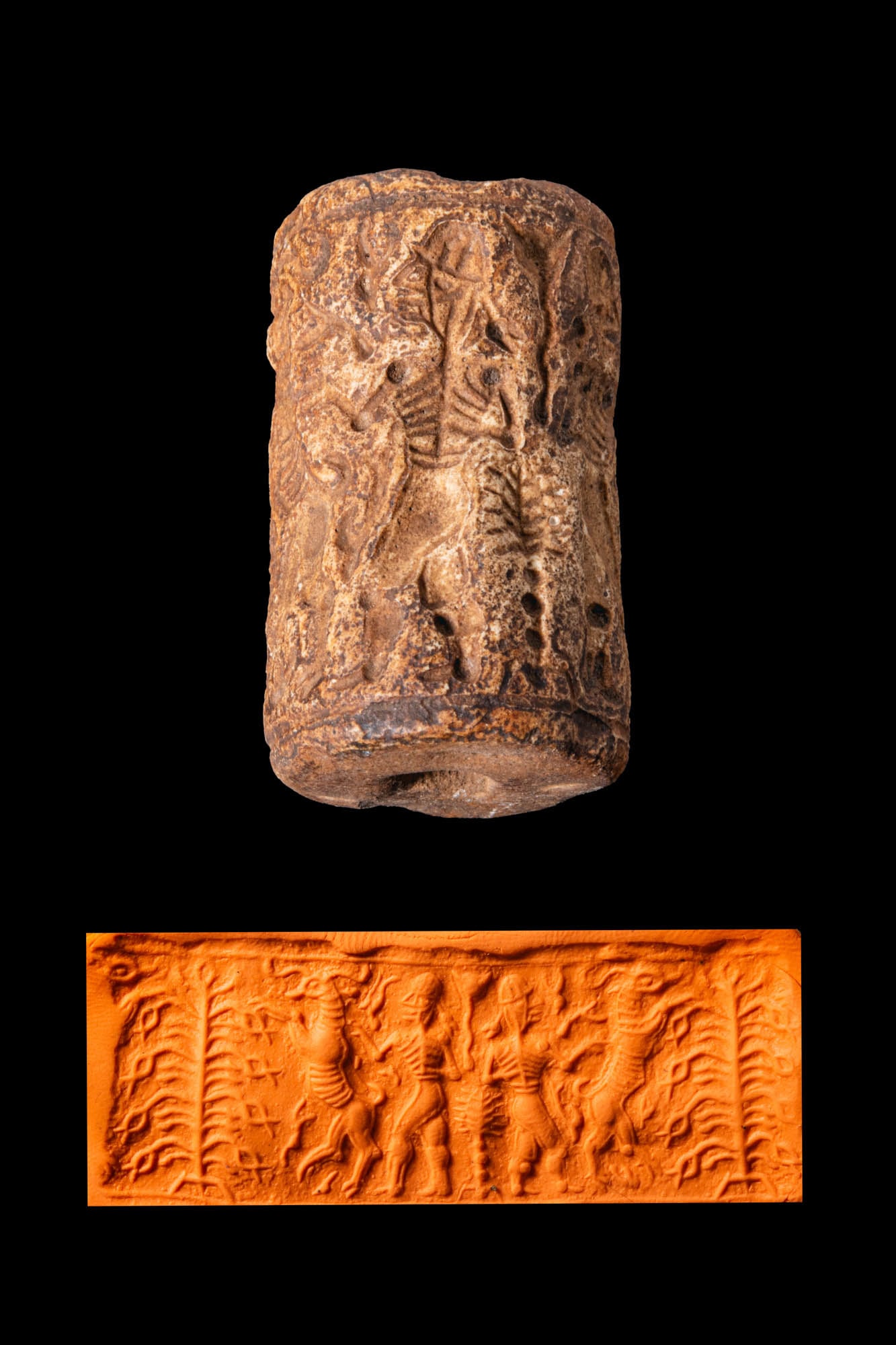 MESOPOTAMIAN OR CENTRAL ASIAN LIMESTONE CYLINDER SEAL WITH A SNAKE-HEADED TREE: Ca. 3000 - 2000 BC. A limestone cylinder seal, drilled longitudinally and engraved with a tree of life whose branches terminate in snake heads. A hero, a gazelle, and another tree of life are in the e