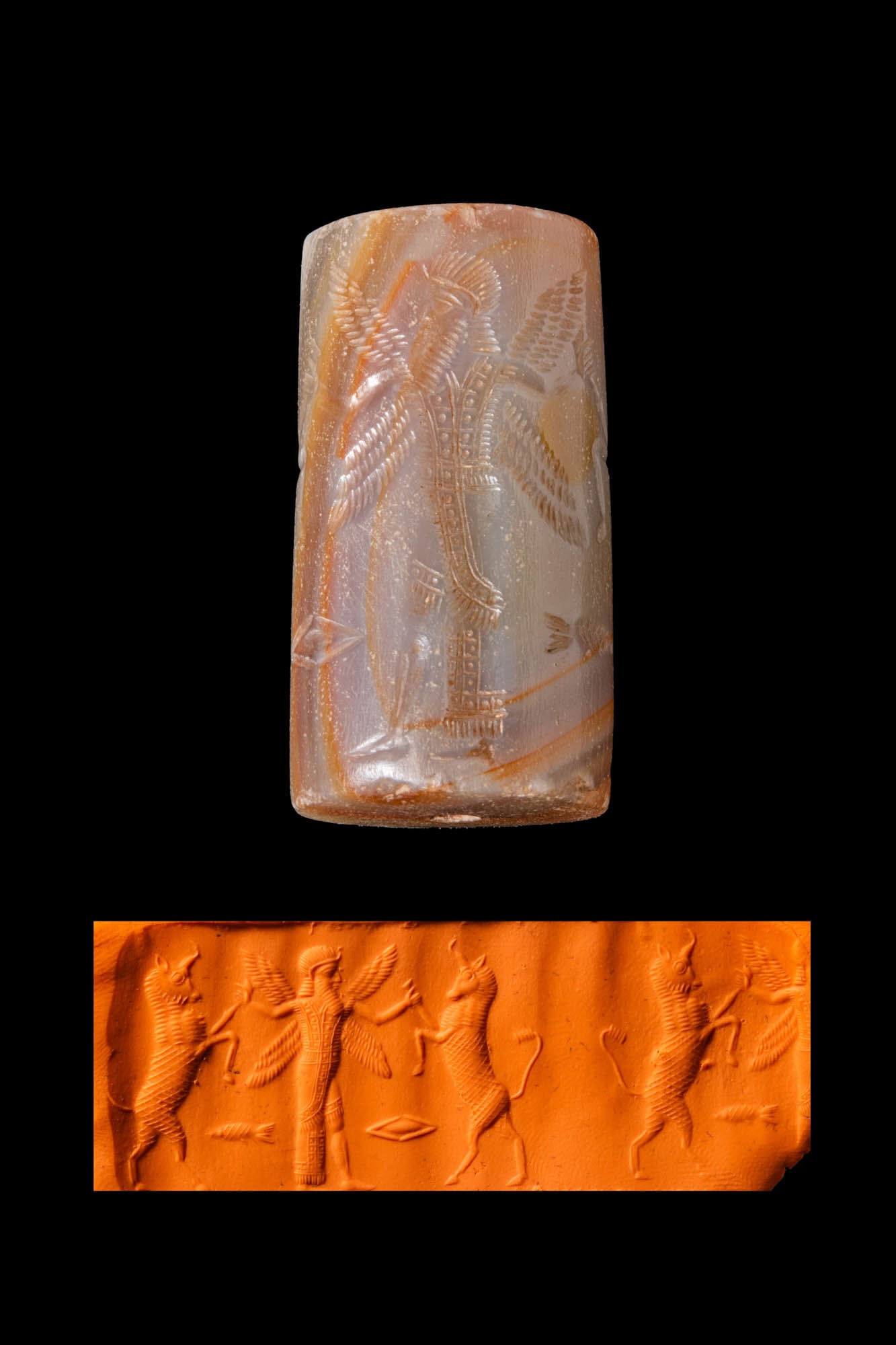 NEO-ASSYRIAN AGATE CYLINDER SEAL WITH A FOUR-WINGED GENIUS AND GAZELLES: Ca. 800 - 650 BC. An agate cylinder seal, drilled longitudinally and engraved with a four-winged genius grabbing two gazelles. A fish and a rhomboid are depicted in the exergue. Size: 33mm x 18mm; Wei