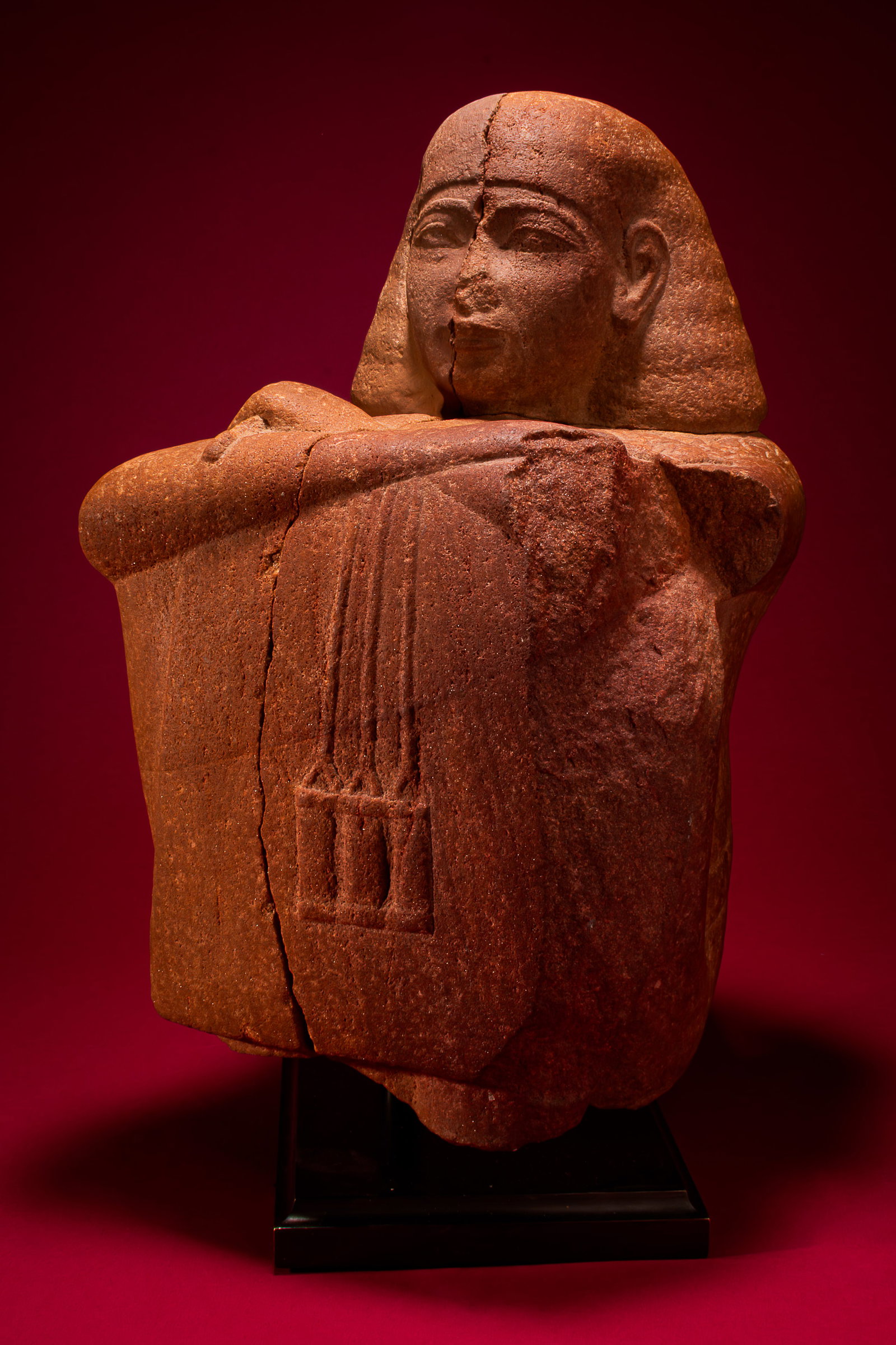 EGYPTIAN RED QUARTZITE BLOCK STATUE OF A PRIEST, POSSIBLY YUYA, PRIEST OF MIN AND FATHER OF QUEEN TI (1 of 7)