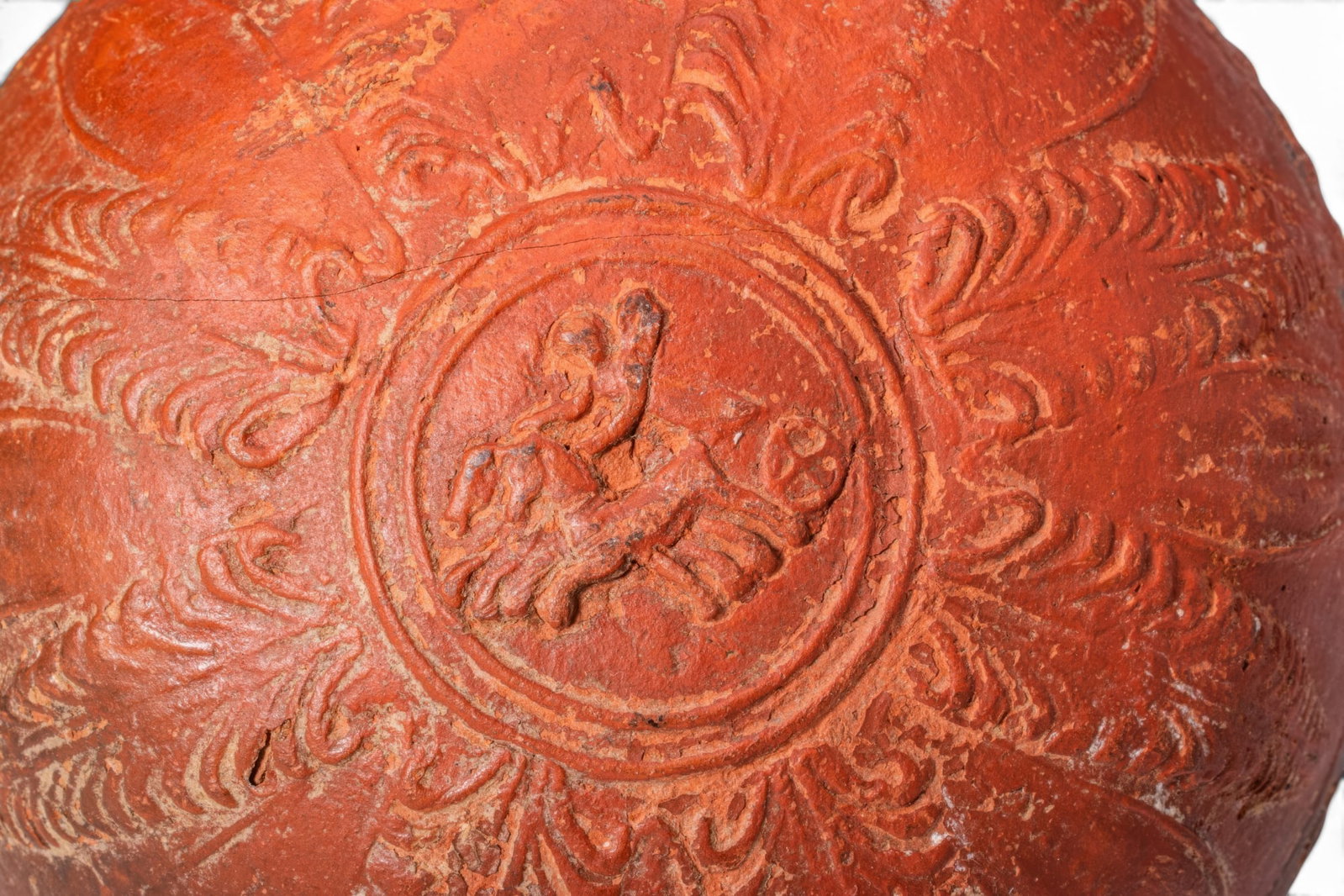 MEGARIAN WARE BOWL WITH NIKE DRIVING A BIGA: Ca. 300 - 100 BC. A red terracotta bowl with a broad, slightly flaring rim and a deep rounded body. The upper zone is plain. Below runs a narrow egg-and-dart frieze. The lower part of the exterior is 