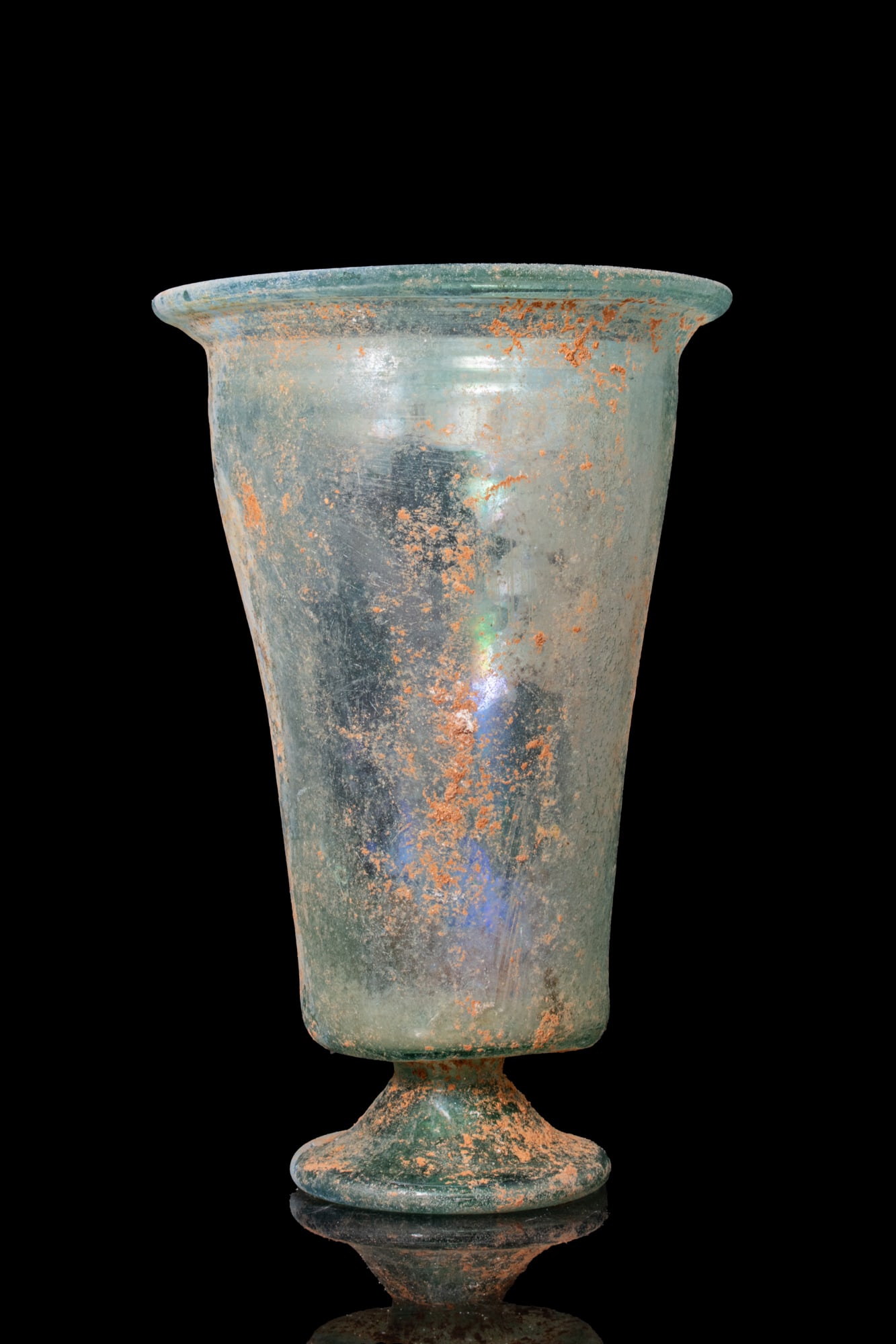 SUPERB ROMAN TRANSLUCENT GLASS BEAKER: Ca. AD 300 - 500. A translucent pale blue-green glass beaker with a flaring body on a hollow spreading foot. For similar see: R. A. Grossmann, Ancient Glass, A Guide to the Yale Collection, fig. 28. S