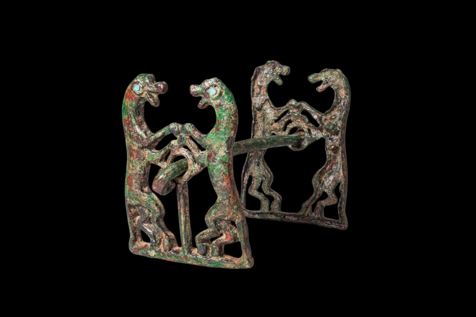 BRONZE AGE HORSE BIT WITH RAMPANT FELINE CHEEK PIECES AND INLAID EYES (1 of 3)