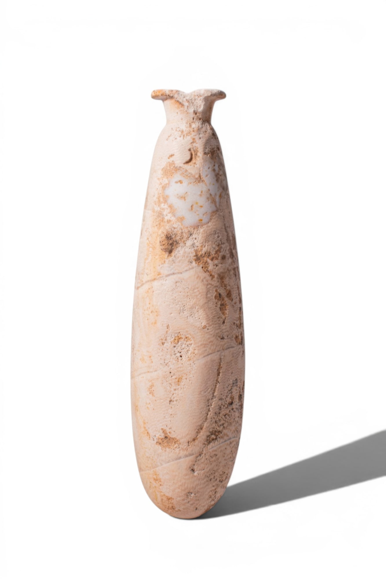 LARGE EGYPTIAN ALABASTER ALABASTRON: New Kingdom, Ca. 1550 - 1069 BC. An alabaster alabastron with a flaring rim above a short neck and a high shoulder with a pair of opposing lugs, the cylindrical body widening to a rounded base. For si