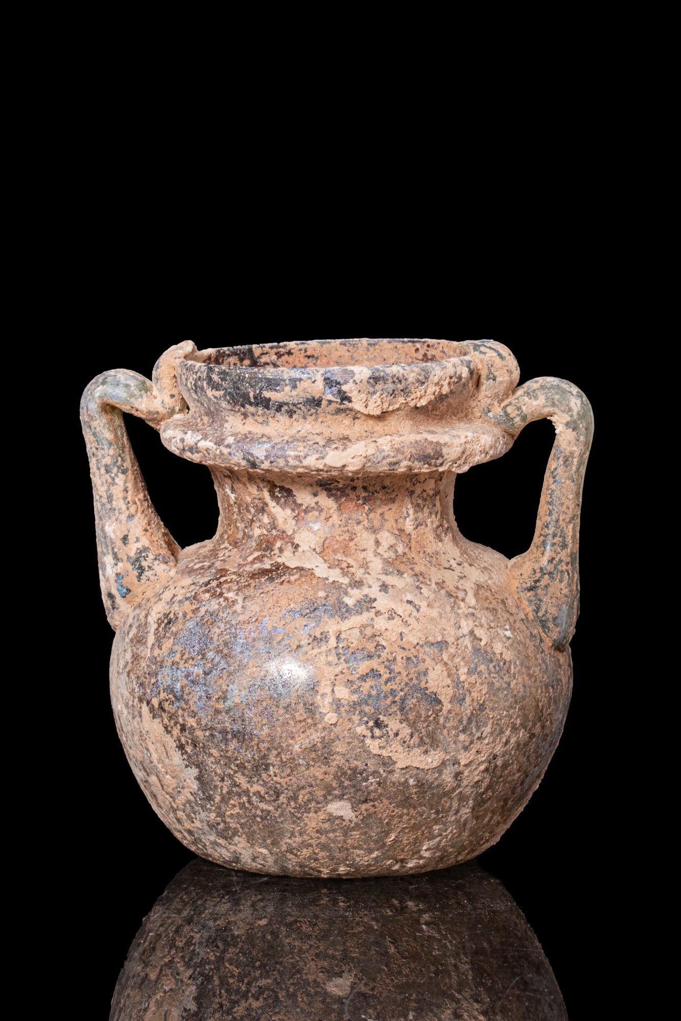 LATE ROMAN GLASS AMPHORISKOS: Ca. AD 300 - 500. A free-blown translucent pale green glass amphoriskos with a globular body, a concave base with a pontil mark, a short cylindrical neck, and a collared mouth. A pair of strap handles