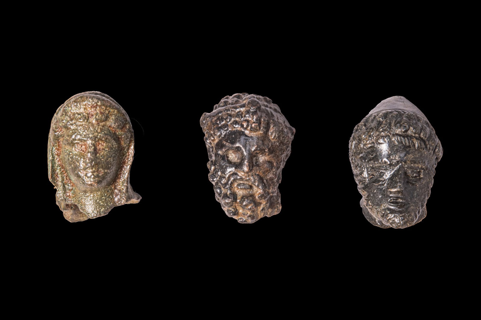 COLLECTION OF HELLENISTIC OR ROMAN BRONZE HEADS OF GODS (1 of 2)