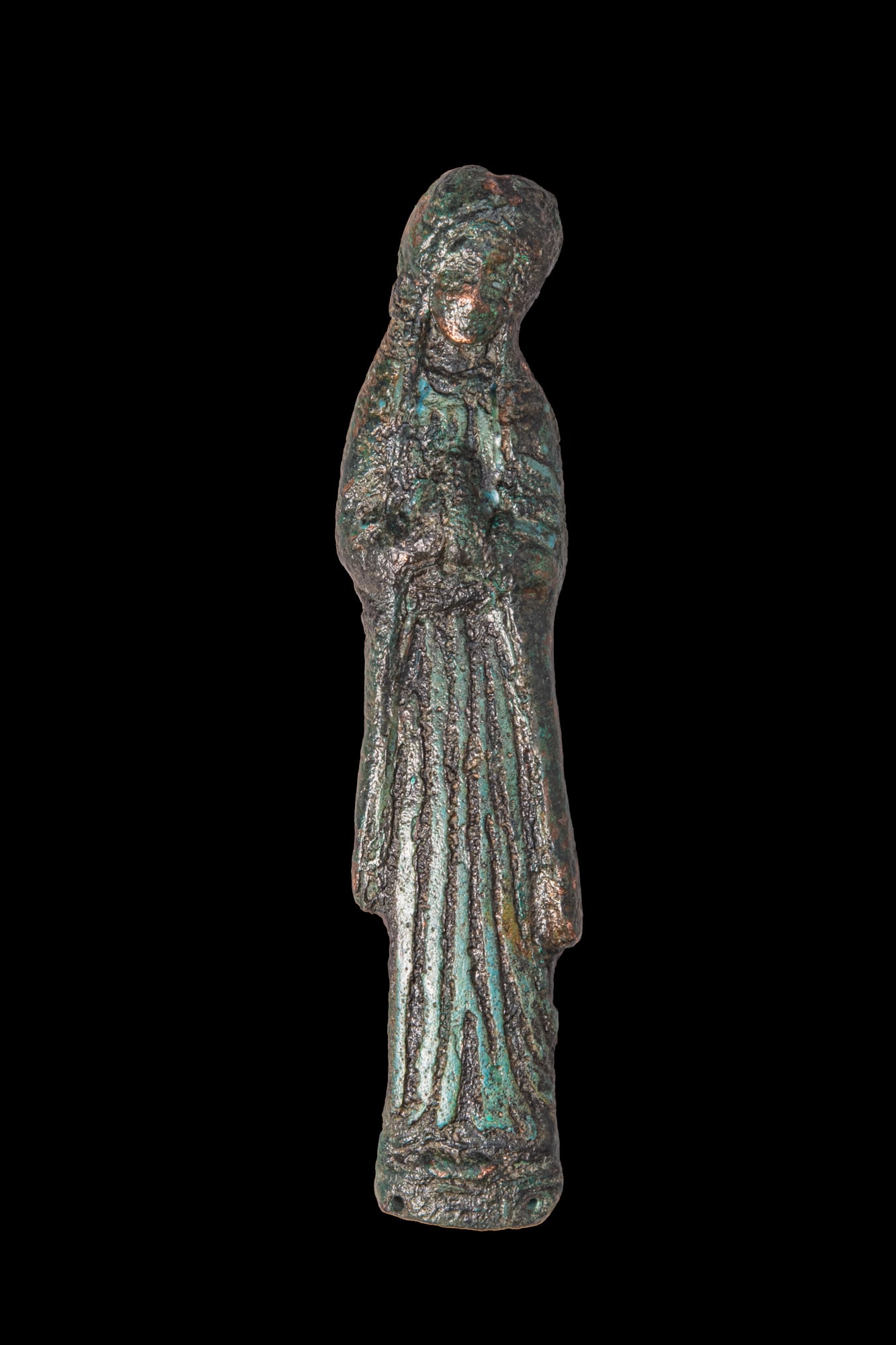 STUNNING MEDIEVAL LIMOGES APPLIQUE OF VIRGIN MARY: Ca. AD 1000 - 1300. A bronze applique of the Virgin Mary standing frontally in a long pleated robe, with the head covered by a veil falling to either side. The figure stands on an integral base pierce