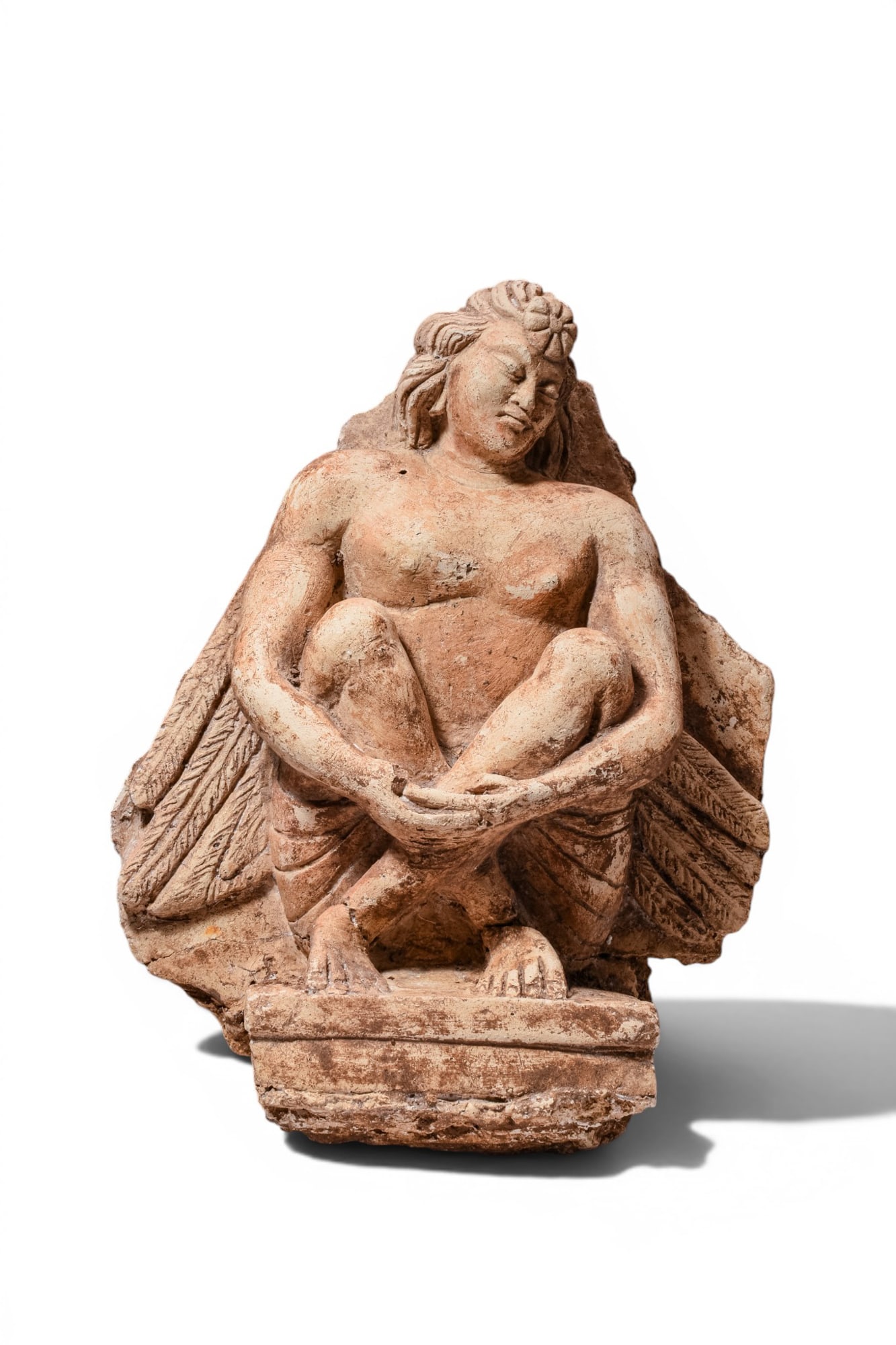 GANDHARA STUCCO WITH WINGED FIGURE: Ca. AD 200 - 500. Gandhara stucco statue portraying a winged figure seated. Size: 330mm x 260mm; Weight: 3.16kg Provenance: Private UK collection; From an old British collection formed in the 1990's.
