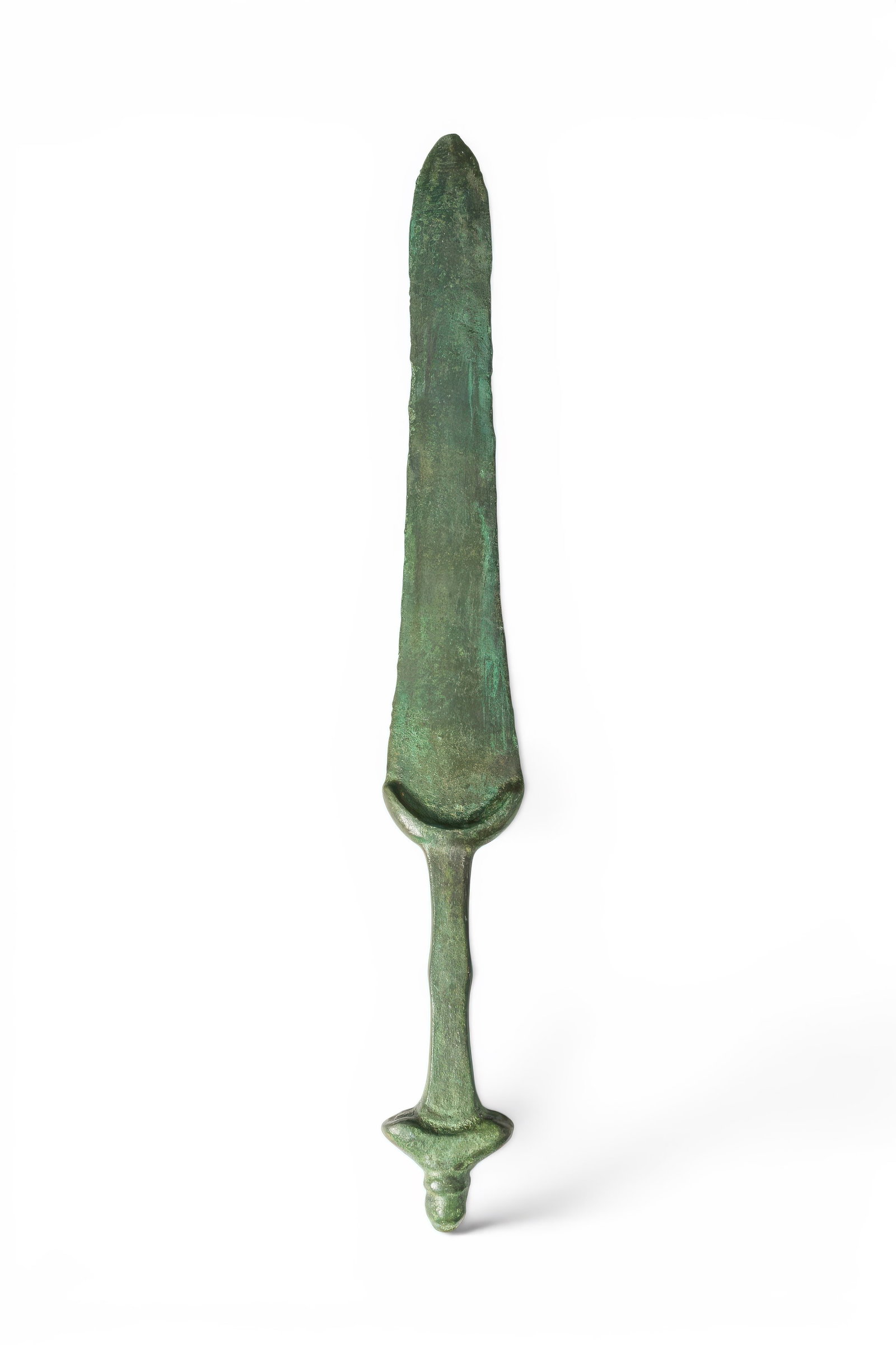 BRONZE AGE / EARLY GREEK PERIOD BRONZE DAGGER: Ca. 1200 - 900 BC. A bronze dagger with a leaf-shaped blade tapering to a rounded point, with a low central rib running along its length and a crescentic guard at the base. The slender waisted grip en